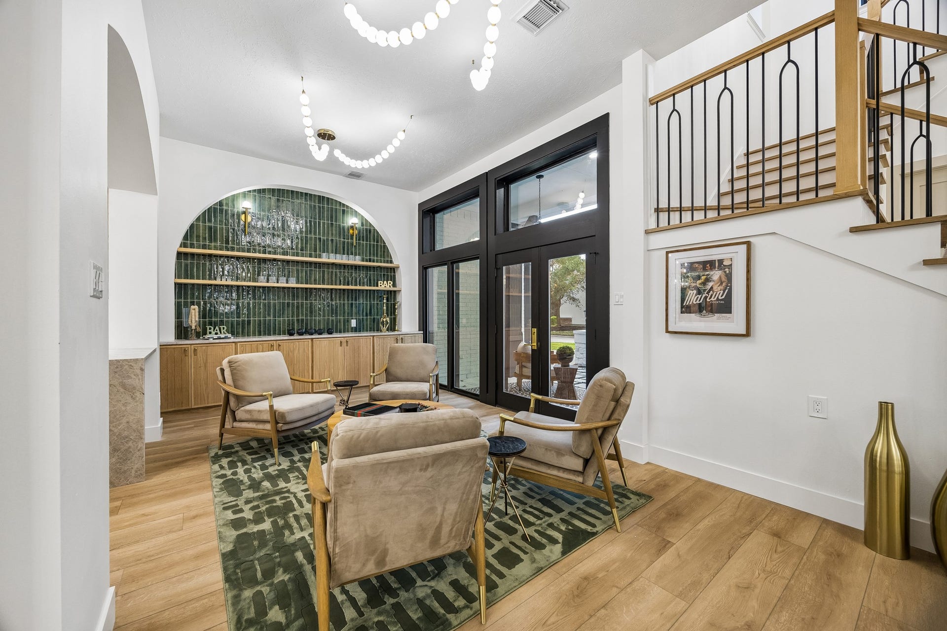 34 N Lansdowne Circle, The Woodlands, TX 77382 Stunning green tile accent the bar area, large french doors take you to your front porch courtyard
