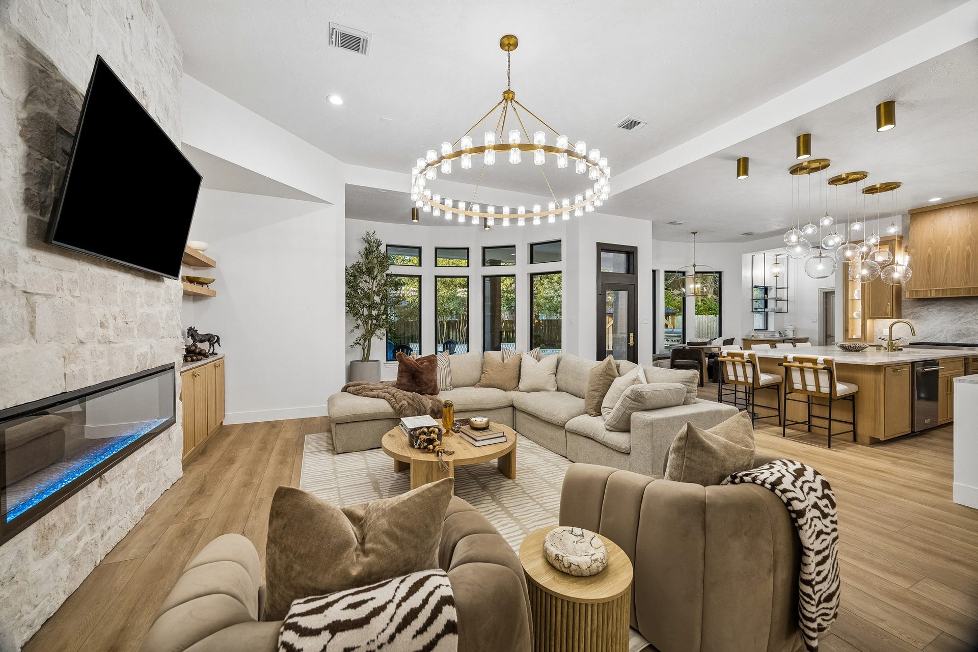 34 N Lansdowne Circle, The Woodlands, TX 77382 Living room anchored by the 72" electric fireplace