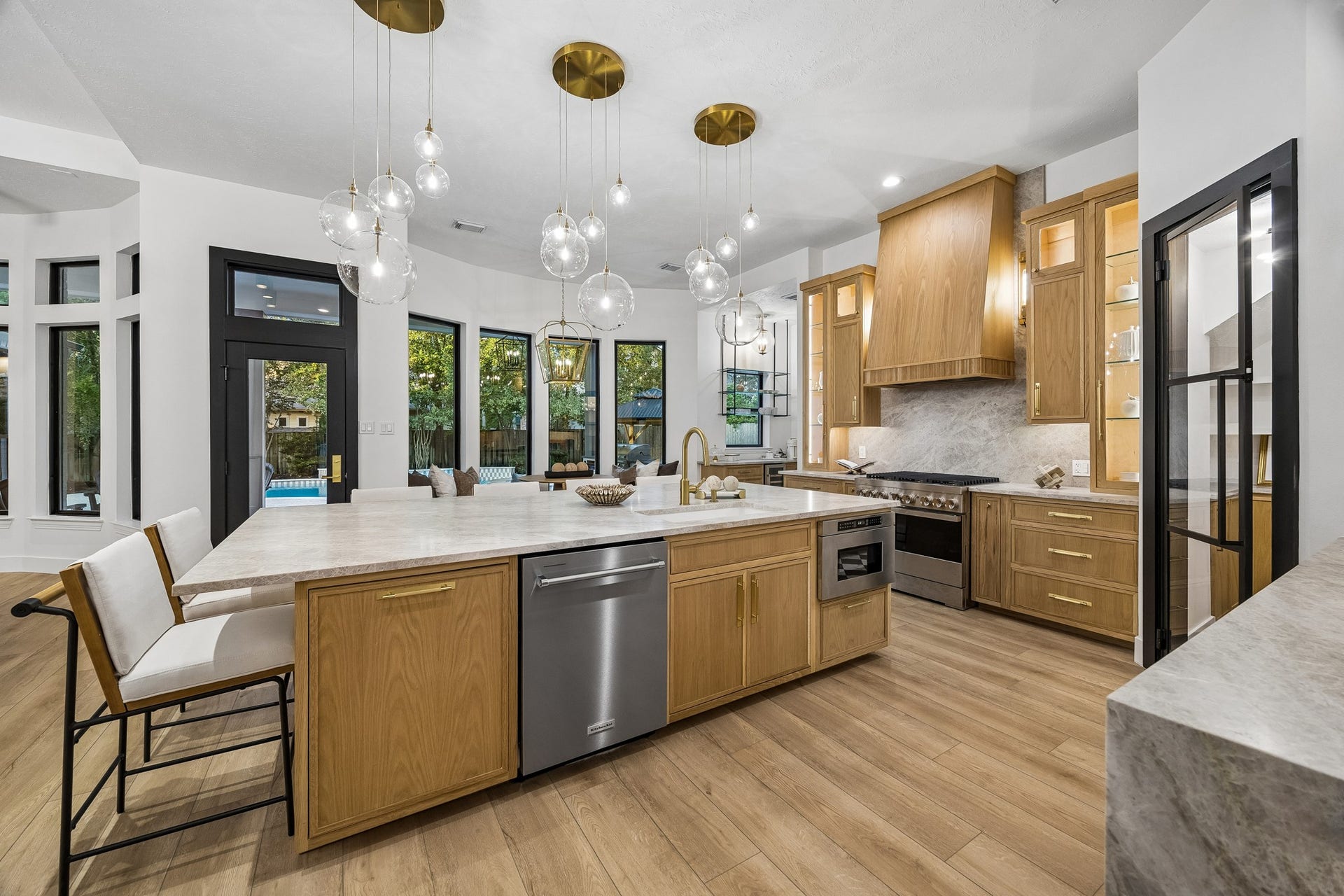 34 N Lansdowne Circle, The Woodlands, TX 77382 Kitchen sink, dishwasher, microwave, and a trash pull out drawer - this island is packed with functionality