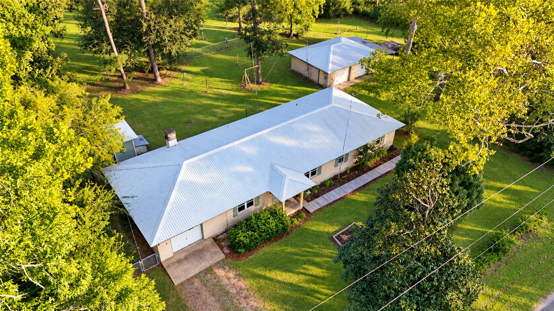 4929 S Elm Avenue, Santa Fe, TX 77517 Aerial View of the House, Detached Garage and the Pump Shed.