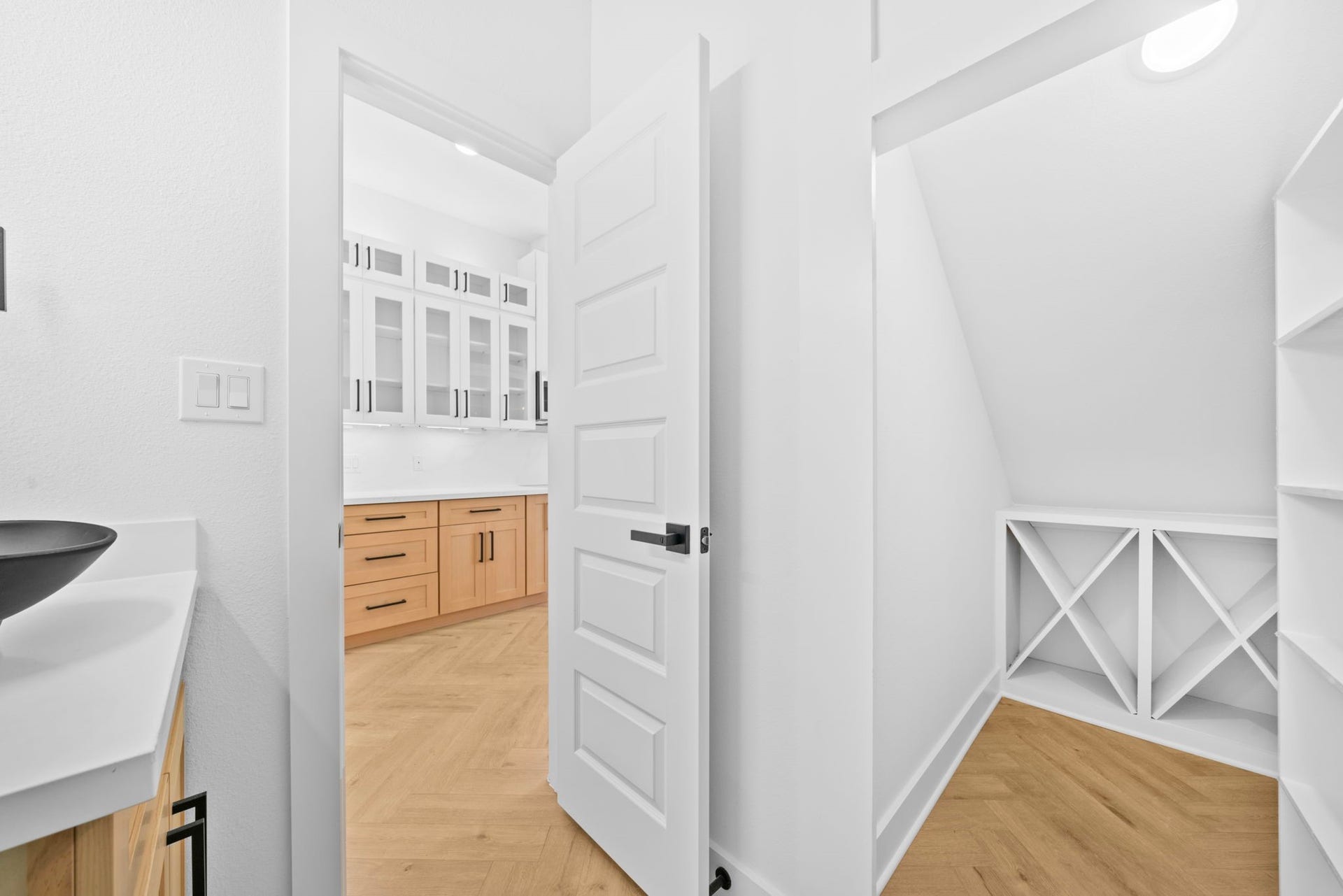 4607 Bricker Street, #A B C, Houston, TX 77051 Hidden undstair closet with built in wine and liquor cabinet behind custom 5 row shelf door
