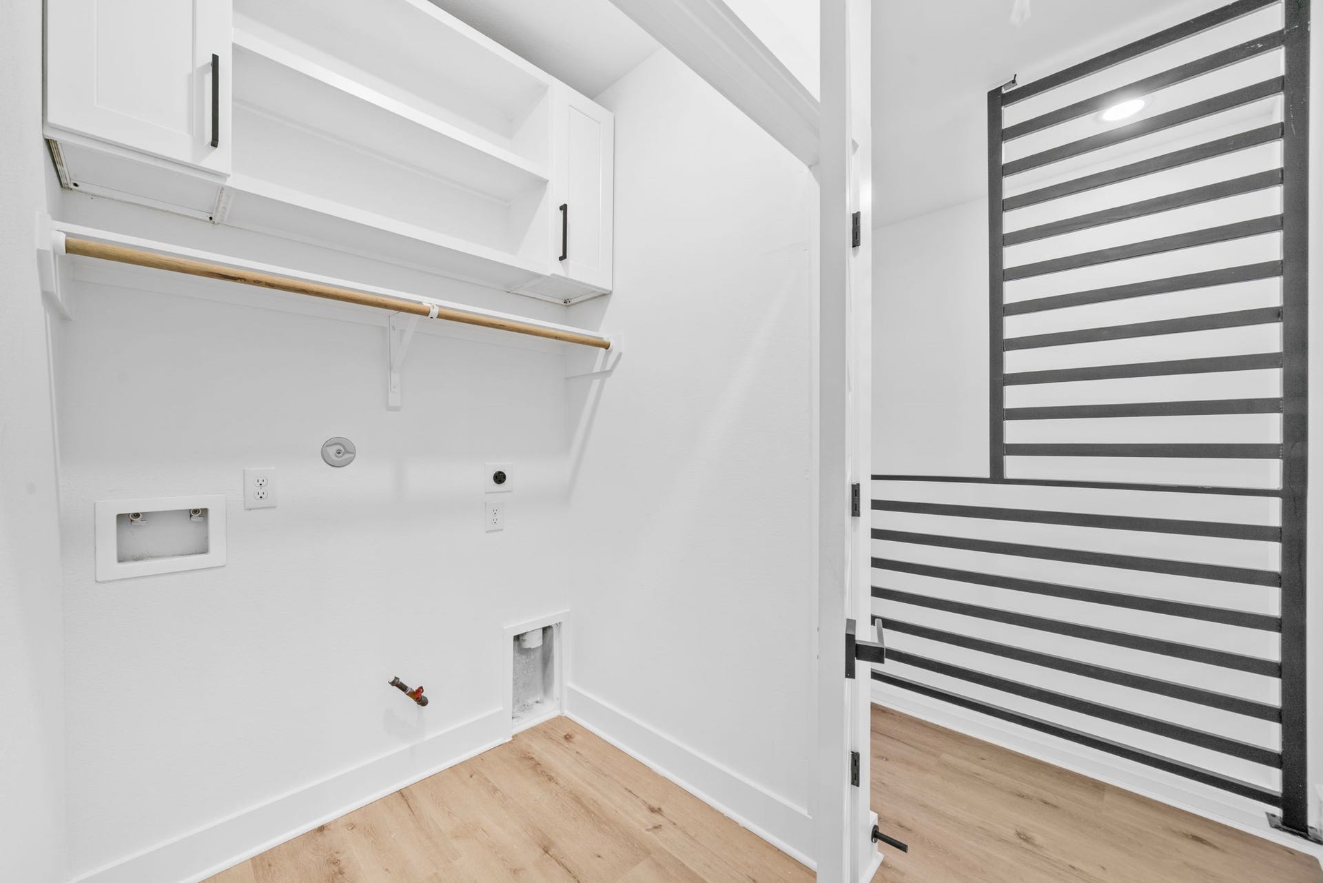 4607 Bricker Street, #A B C, Houston, TX 77051 Unit C laundry closet with built in cabinets and shelves.