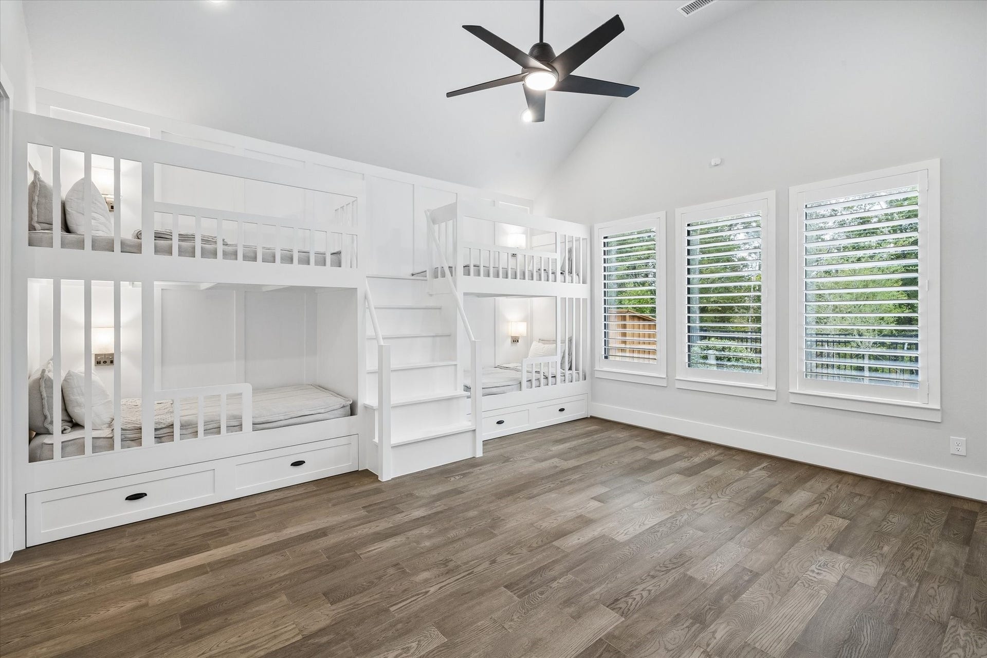 27720 Hazelbrook Lane, Spring, TX 77386 Your massive Gameroom features professionally designed bunk beds. Notice the added sconces, upgraded ceiling fan, recessed lighting, plantation shutters & stunning view of mature trees. Plenty of room for additional seating/gaming in this room.