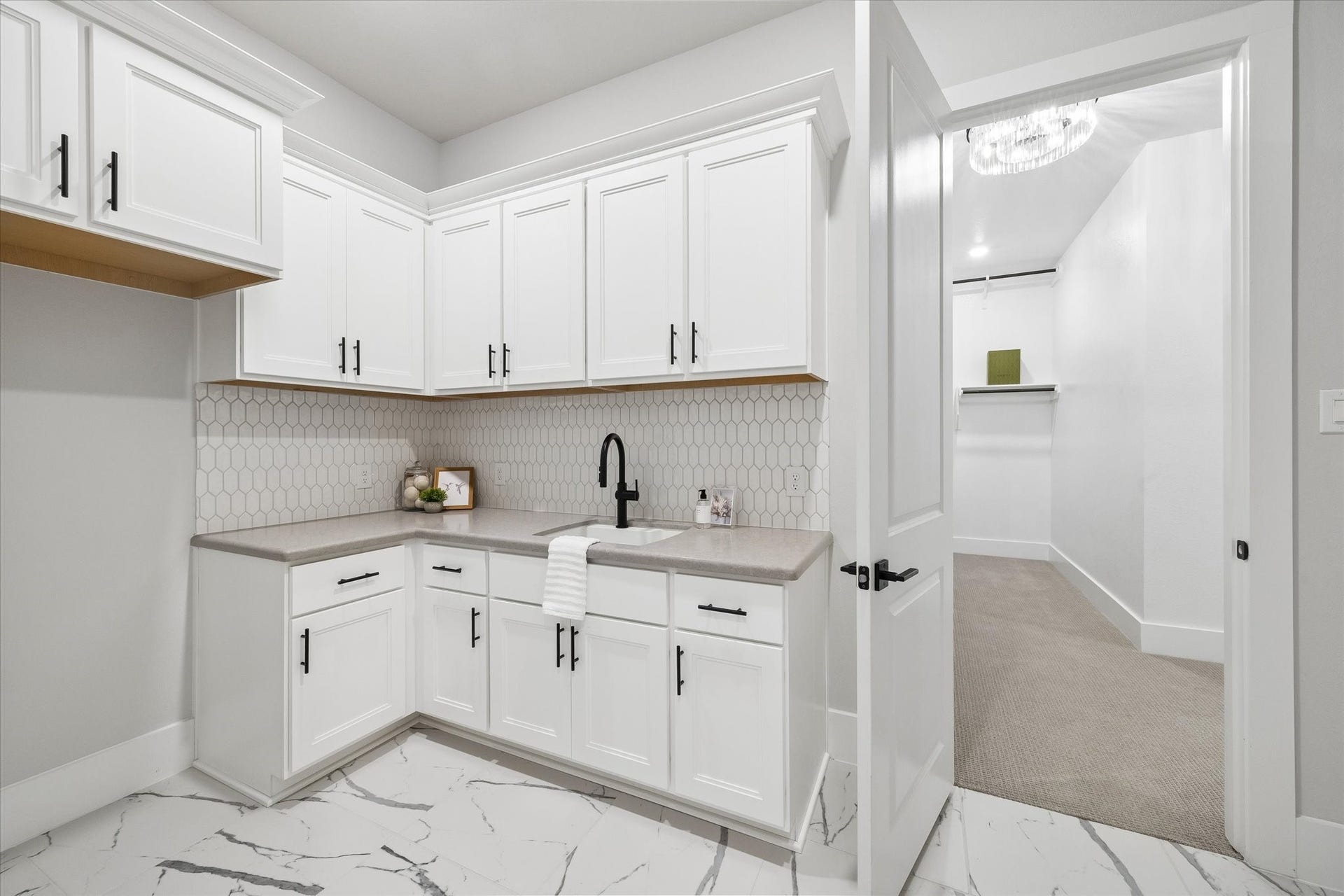27720 Hazelbrook Lane, Spring, TX 77386 Your spacious Laundry Room is a dream! You have access from your Primary Closet & Mud Room. Upgraded Sink, tons of Cabinetry, counter space, room for an extra fridge. The washer and dryer would be installed to the right of this photo (area not pictured).