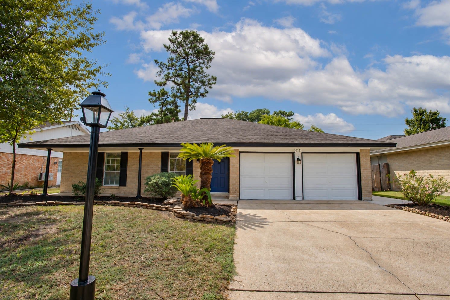16131 Forest Way Drive, Houston, TX 77090 Front of home which has great curb appeal, garden beds and a nice a front patio.