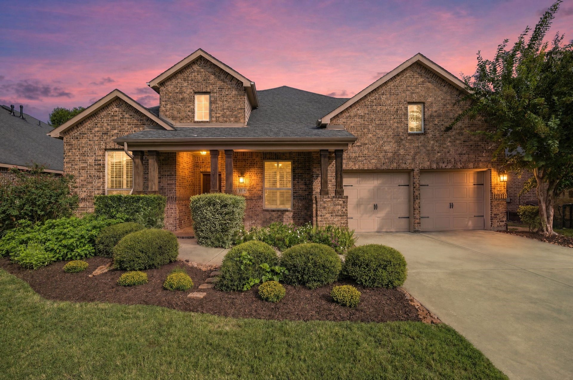 8319 Floating Heart Court, Conroe, TX 77385 Twilight elegance in gated Harpers Preserve.