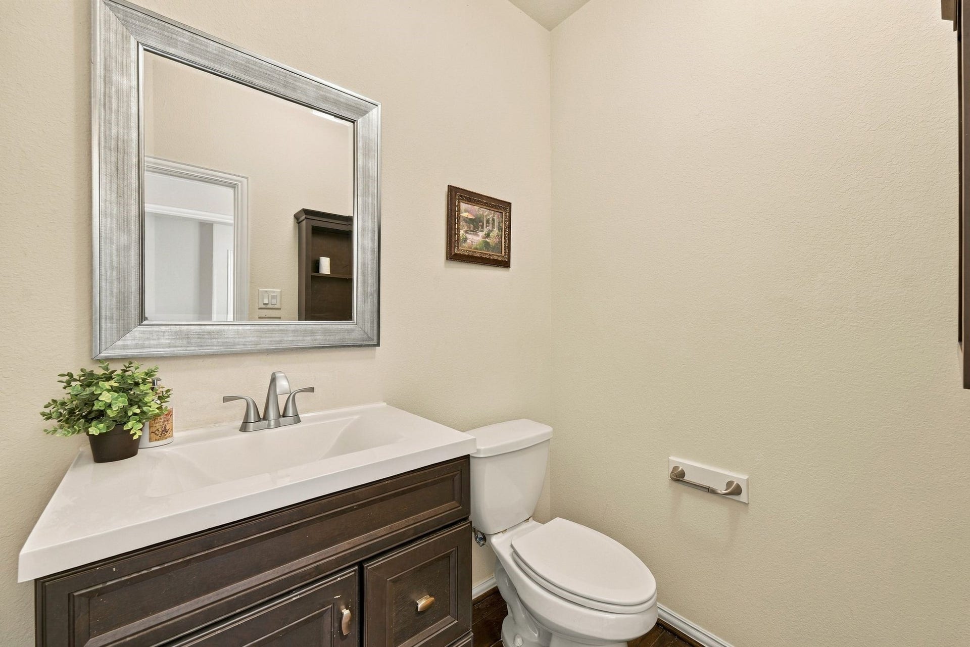 8319 Floating Heart Court, Conroe, TX 77385 Well appointed Guest half bathroom right outside the office.