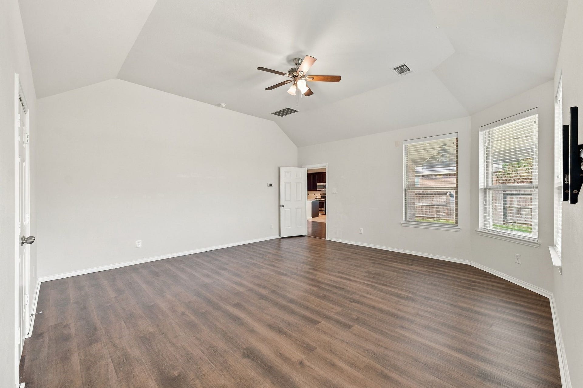 8319 Floating Heart Court, Conroe, TX 77385 A wall of windows fills the primary suite with natural light while preserving ample space for furnishings.