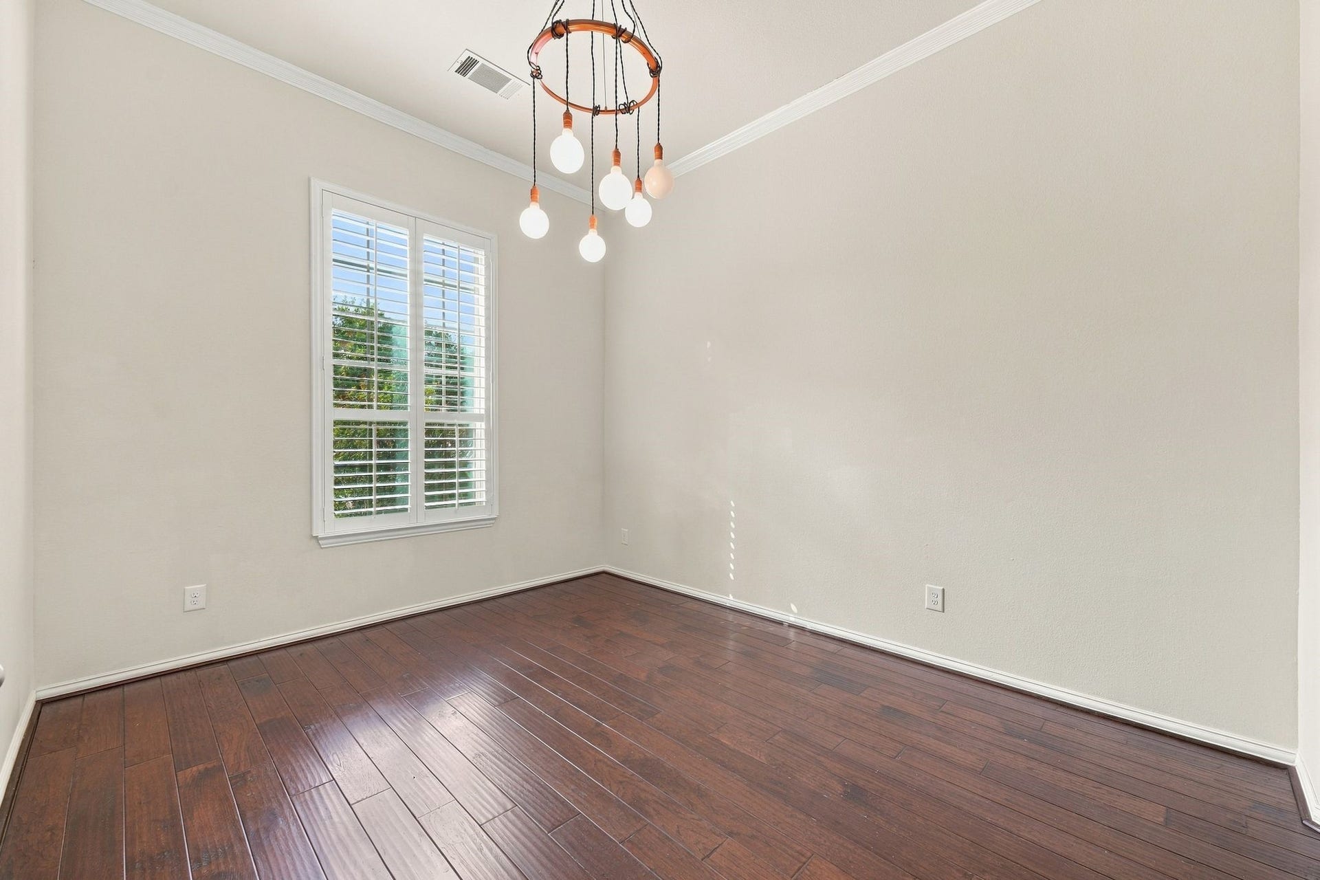 8319 Floating Heart Court, Conroe, TX 77385 Private home office with French doors, rich hardwood floors & abundant natural light.