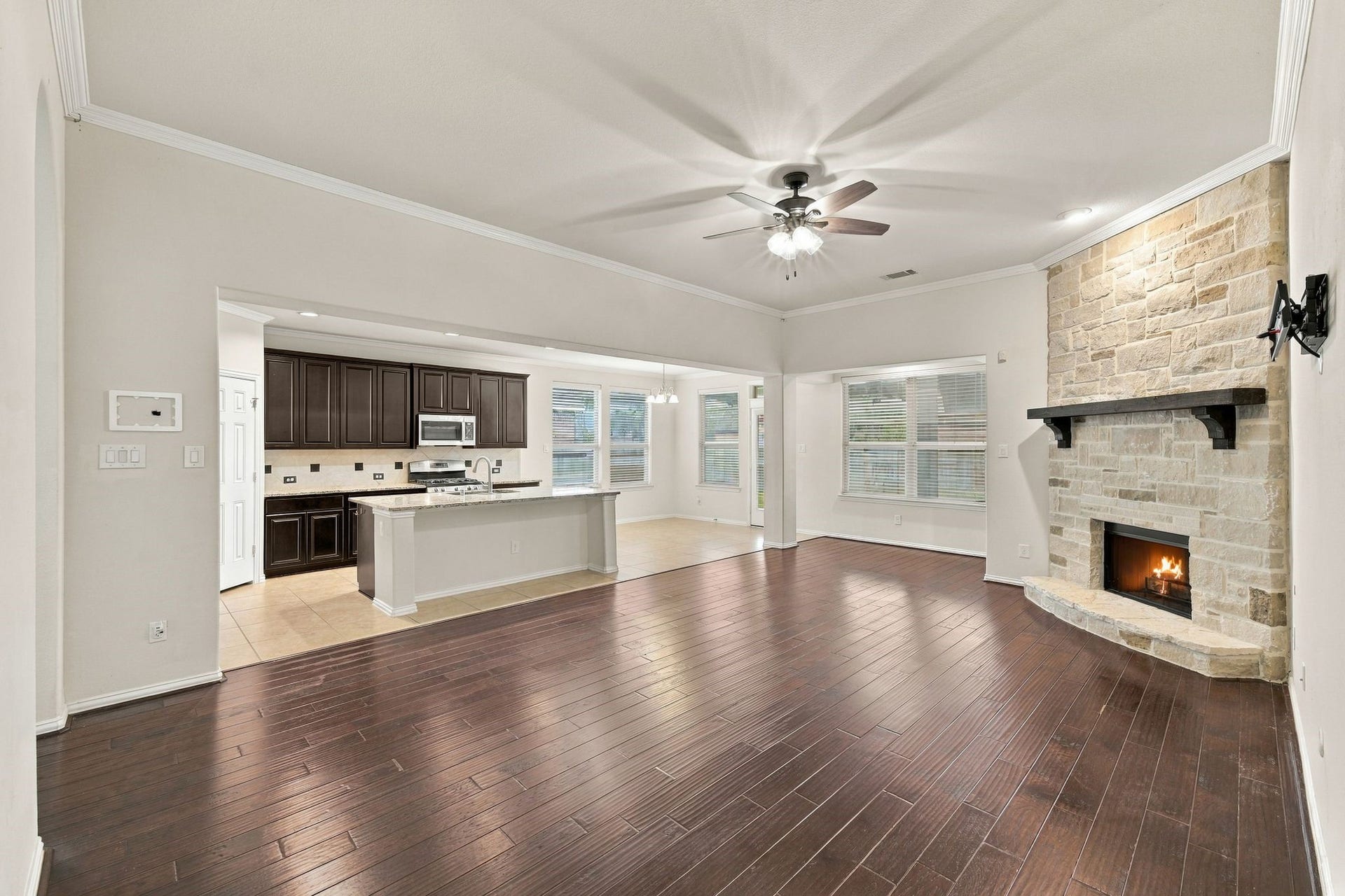 8319 Floating Heart Court, Conroe, TX 77385 Open-concept living with seamless flow into the kitchen and breakfast area.