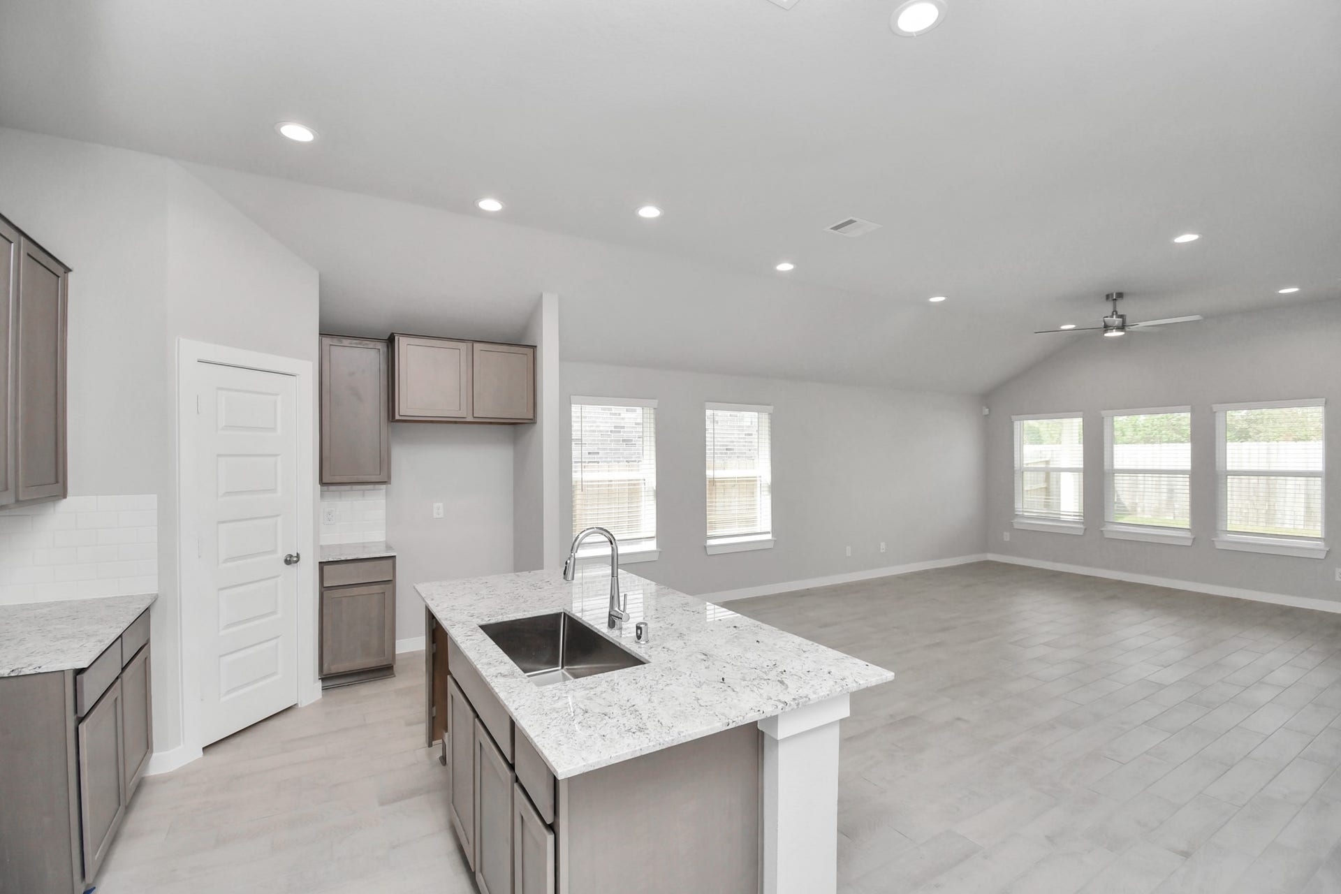 11027 Gardenia Creek Drive, Houston, TX 77044 All of this overlooks your expansive family room, creating a perfect space for culinary delights and family gatherings. Sample photo of completed home with similar floor plan. Actual colors and selections may vary.
