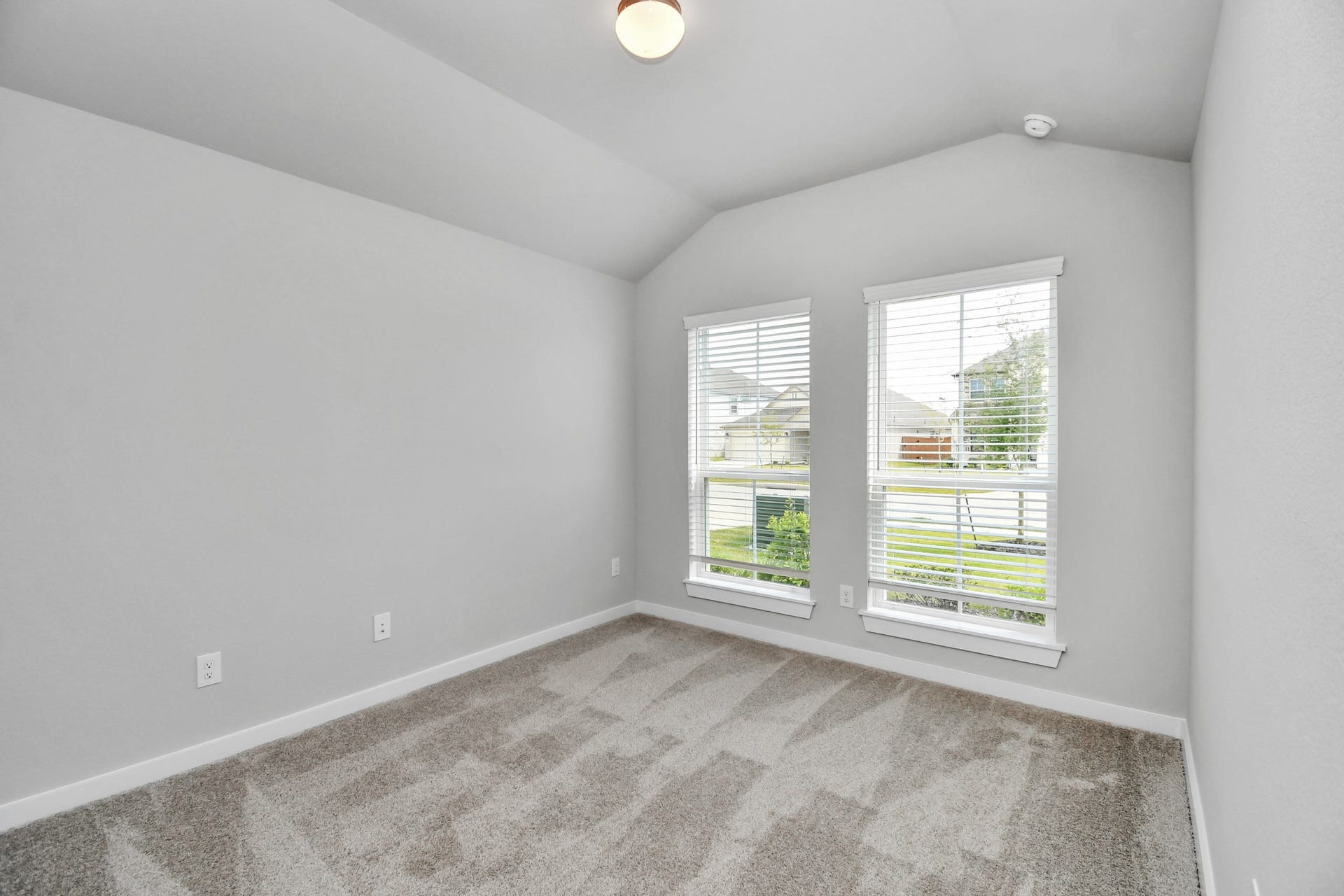11027 Gardenia Creek Drive, Houston, TX 77044 Generously sized secondary bedrooms featuring spacious closets, soft and inviting carpeting underfoot, large windows allowing plenty of natural light, and the added touch of privacy blinds for your personal retreat. Sample photo of completed home with similar floor plan. Actual colors and selections may vary.
