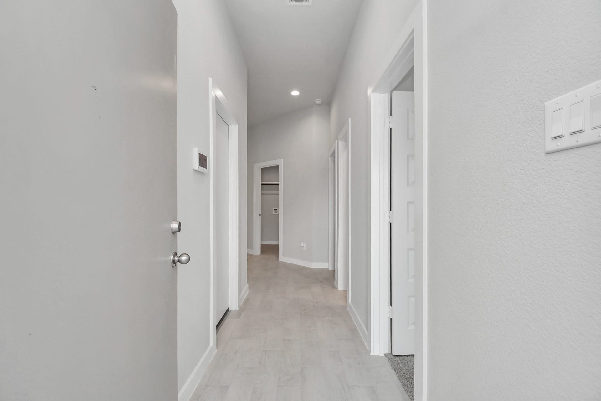 11027 Gardenia Creek Drive, Houston, TX 77044 As you step into the threshold of this luxurious home, you'll soon be welcomed by an elegant glass door (to be installed). Inside, soaring ceilings amplify the spaciousness, while the refined wood-look tile flooring and oversized baseboards exude sophistication and charm. Sample photo of completed home with similar floor plan. Actual colors and selections may vary.