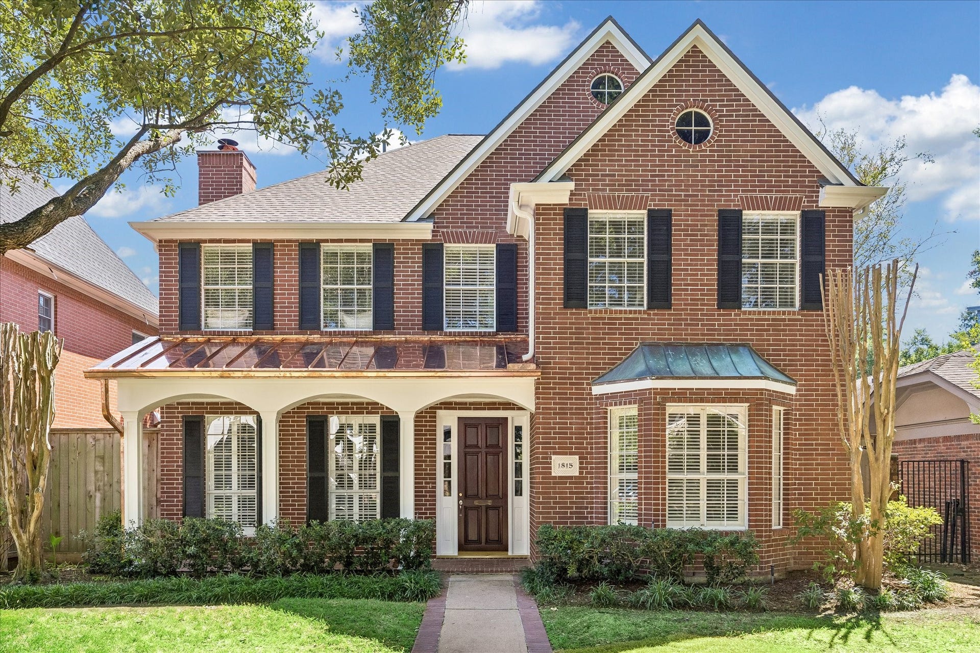 1815 Albans Road, Houston, TX 77005 This custom-built two-story brick Southampton home has a formal living room with fireplace and oak hardwood flooring, formal dining room, family room with French doors that open to a custom stone garden/patio, study with built-ins, and large bonus room off the Primary bedroom/bath, that can be used as a home office/exercise room, gameroom, nursery or a master retreat. The primary has his and her baths.