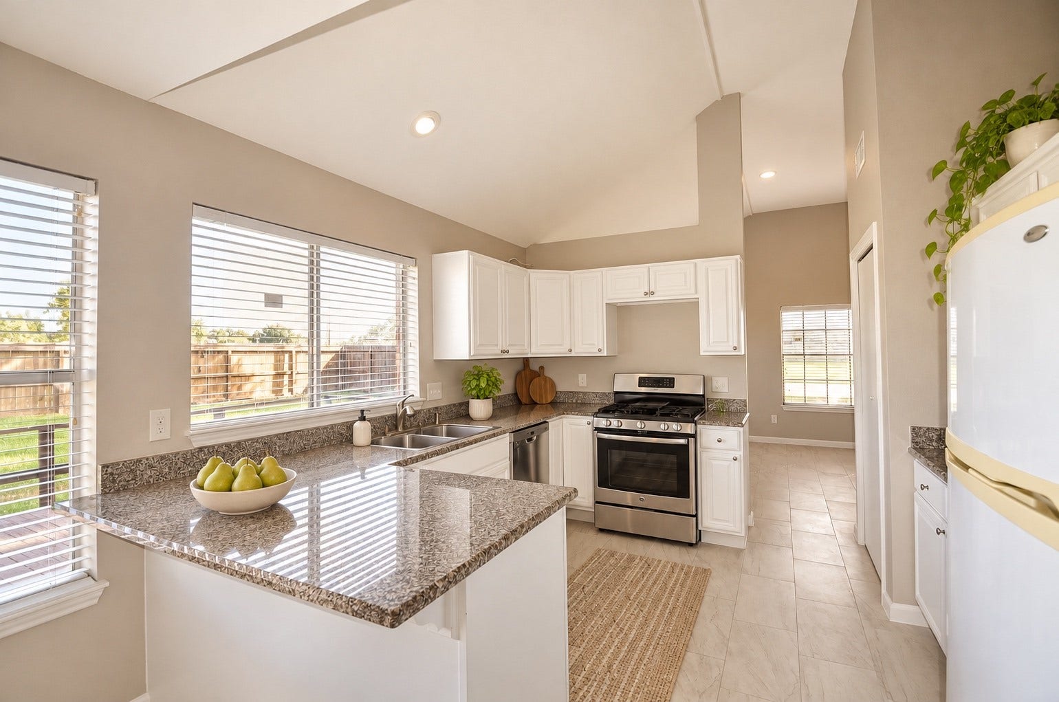 Discover the perfect blend of style and functionality in this bright kitchen, featuring sleek granite countertops, modern stainless steel appliances, and abundant natural light streaming through expansive windows.