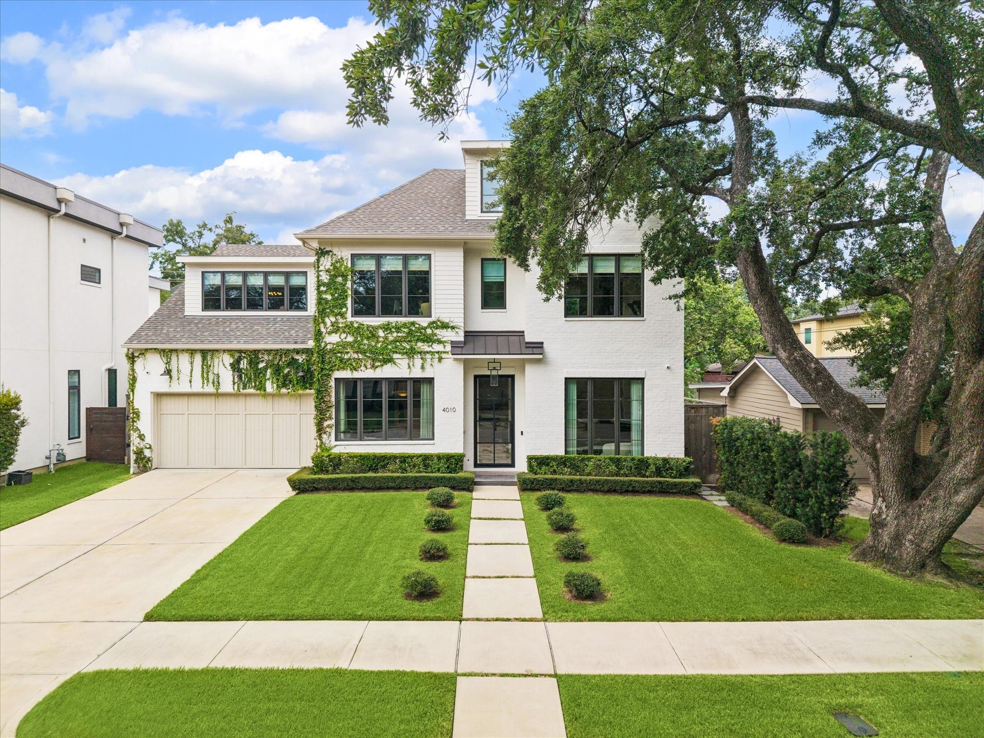 4010 W Alabama Street, Houston, TX 77027 A recently constructed Highland Village residence offering 5 bedrooms, 5 full baths and 2 half baths with a timeless brick exterior. Thoughtfully designed with curated interiors and elevated finishes, the home blends classic architecture with sophisticated modern living. Manicured landscaping, custom privacy plantings and a welcoming entry create a refined first impression.