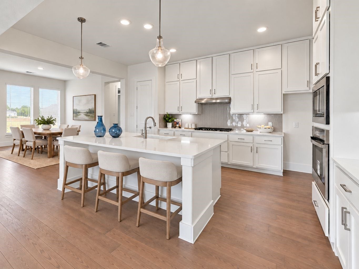 A Chef's Dream Kitchen! Fall in love with this stunning gourmet kitchen featuring gorgeous custom white cabinetry extending all the way to the ceiling, beautiful quartz countertops, and a spacious center island with breakfast bar seating! Stylish pendant lighting adds that perfect designer touch! Enjoy the gas cooktop, stainless steel appliances, and an abundance of counter space for preparing your favorite meals! Designed for both everyday living and wonderful gatherings with family & friends! Virtal stage