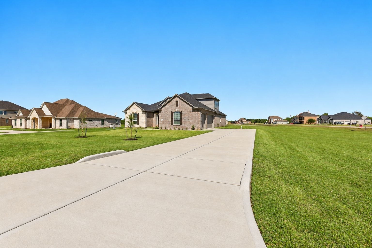 NEED PARKING SPACE? NO PROBLEM HERE! Just LOOK at this GIANT CONCRETE DRIVEWAY leading to an IMPRESSIVE 4-CAR ATTACHED GARAGE! Imagine the convenience of having PLENTY OF ROOM for your vehicles, visiting guests, hobbies & storage! This STUNNING NEW HOME sits on a MASSIVE 1.163-ACRE CORNER LOT, offering INCREDIBLE OPEN SPACE & ENDLESS POSSIBILITIES!