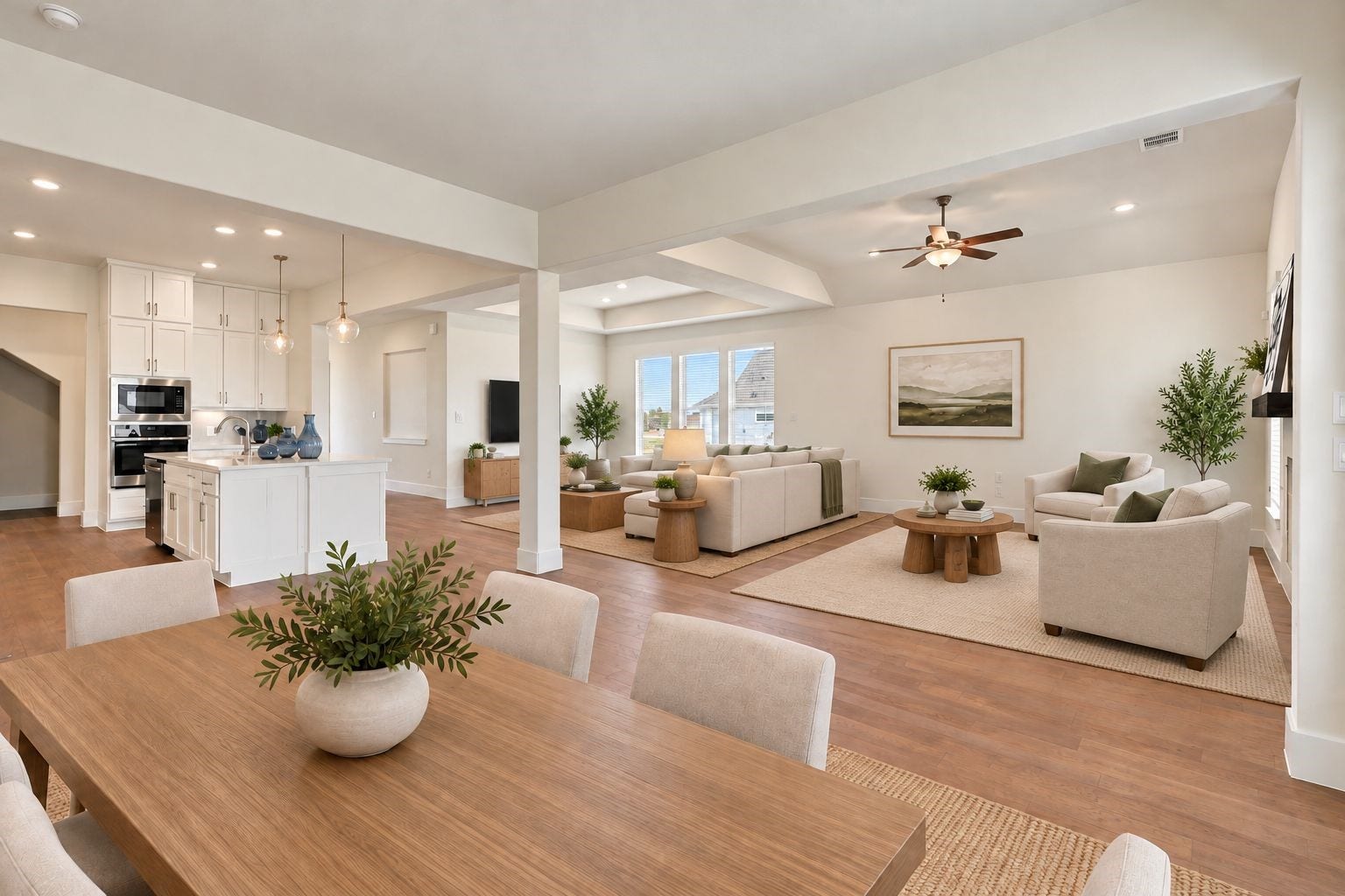 ELEGANT OPEN-CONCEPT LIVING! Experience the perfect blend of style and functionality in this spacious open-concept design, showcasing the dining area, inviting family room, and BEAUTIFUL KITCHEN! GORGEOUS ENGINEERED WOOD FLOORING flows throughout the main living areas, creating a warm, cohesive look ideal for entertaining and everyday living! **Photo is Virtually Staged**