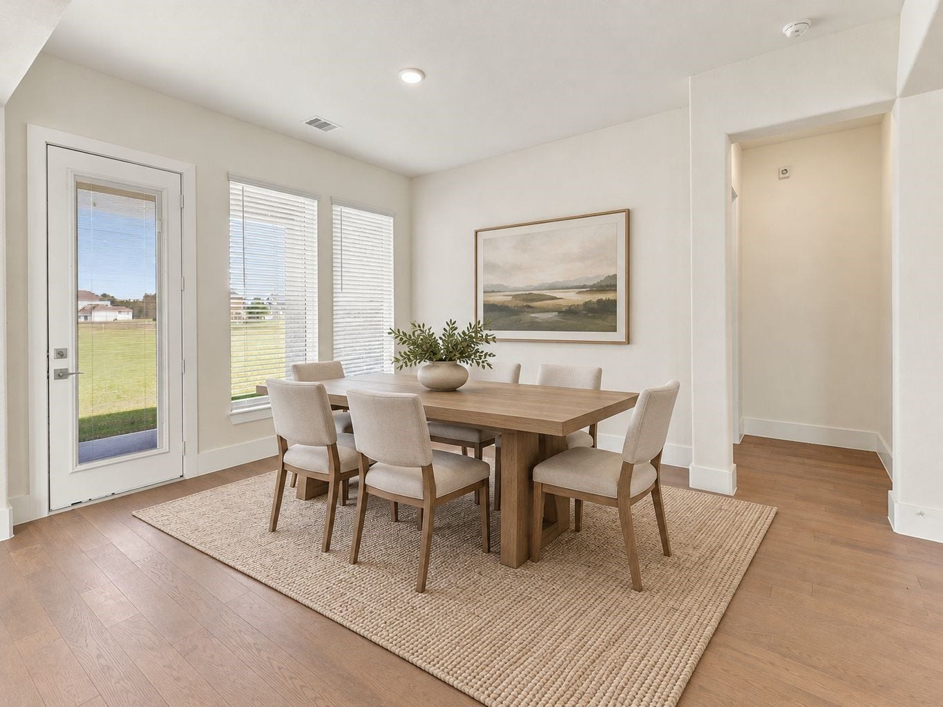 What a charming place to gather! This beautiful casual dining area welcomes an abundance of natural light, creating a bright, cheerful setting for morning coffee, family breakfasts, and memorable dinners! The wonderful open-concept design flows effortlessly into the gourmet kitchen, making serving meals and entertaining a breeze! Gorgeous, engineered wood flooring adds warmth, elegance, and timeless charm throughout the main living areas. A perfect place to make everyday memories! Photo is Virtually Staged.