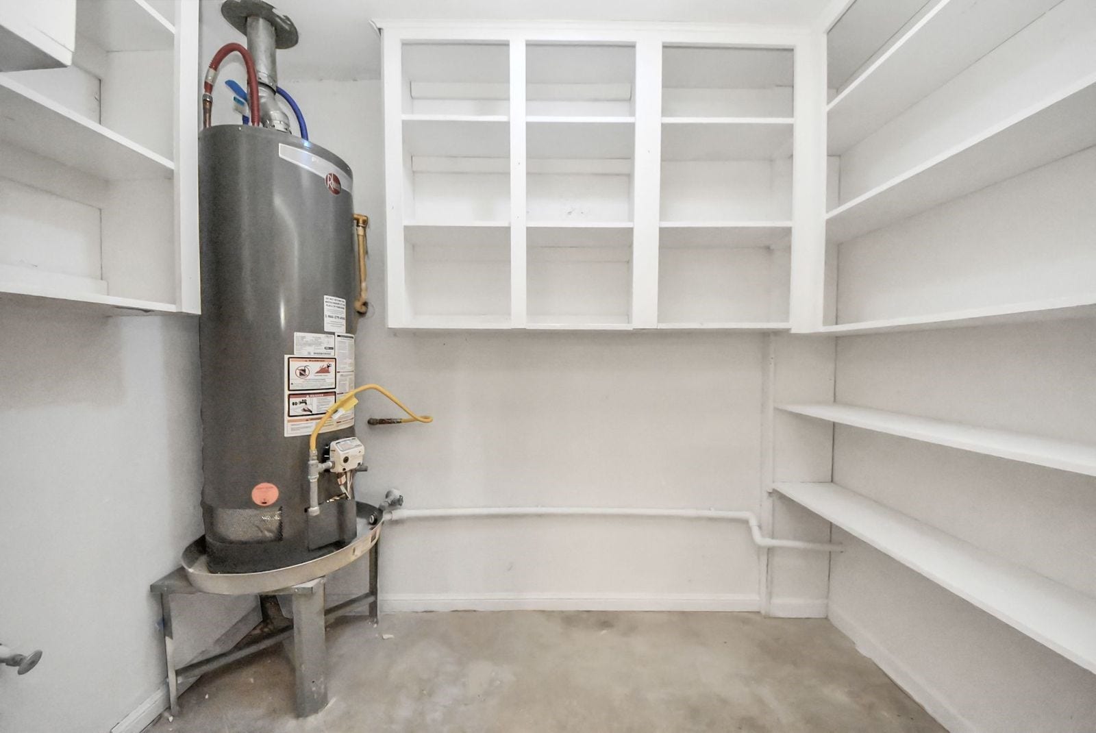 3013 Woodland Drive, Dickinson, TX 77539 Work/storage area with the water heater and it's own sink.