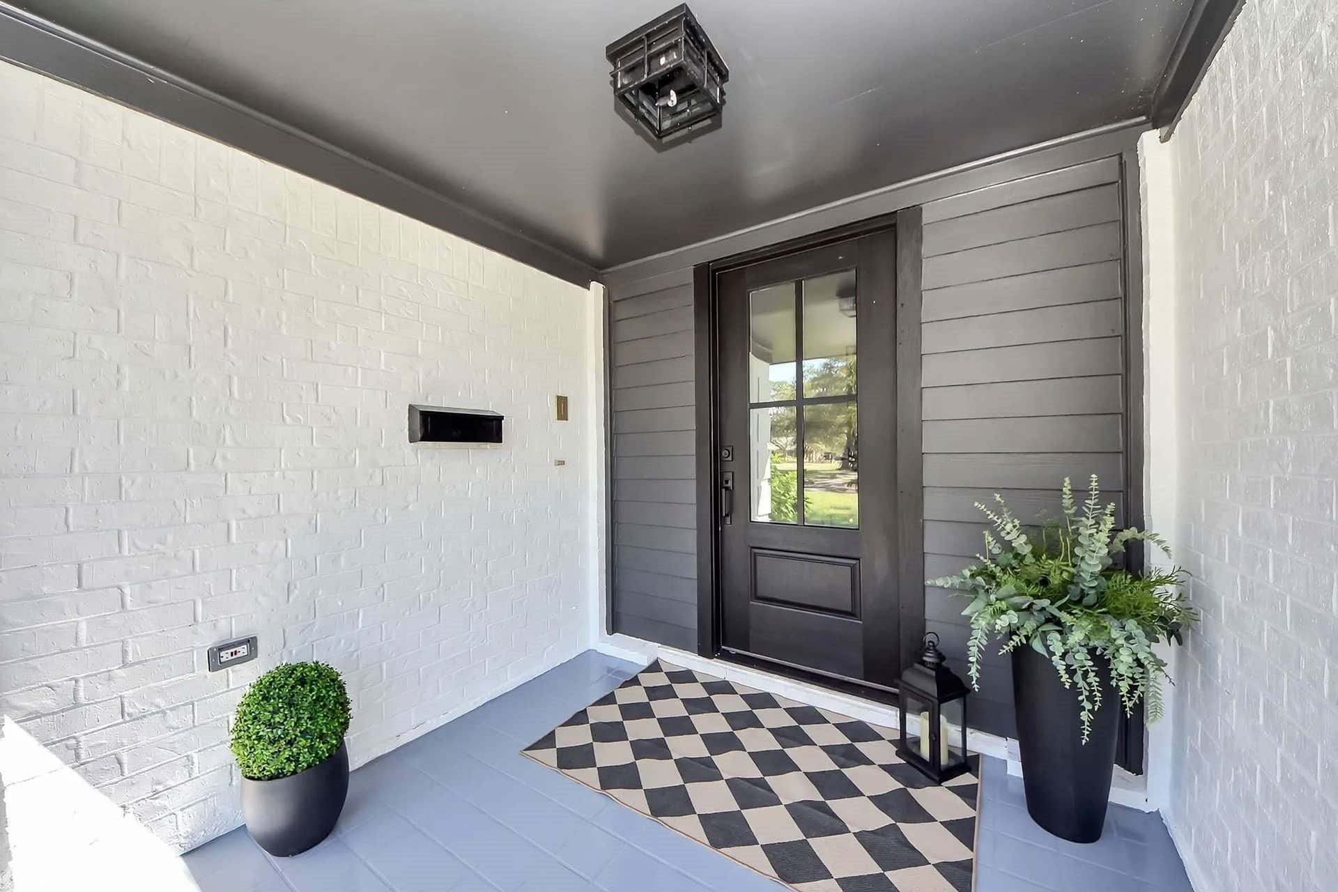3013 Woodland Drive, Dickinson, TX 77539 New modern black & glass door with black soffit paint accent really brings this together.