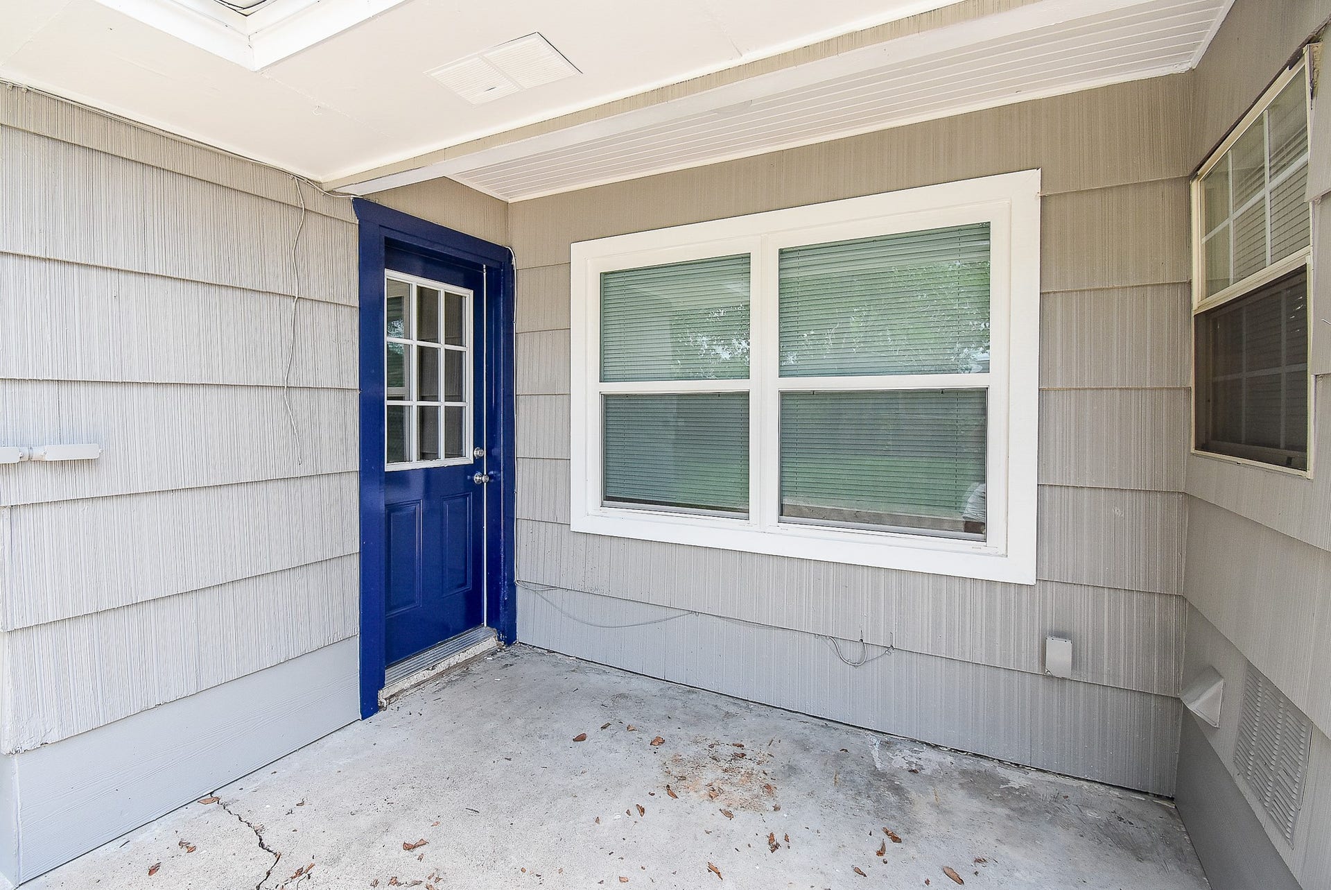 7406 Schiller Street, Houston, TX 77055 Exterior door and covered patio.