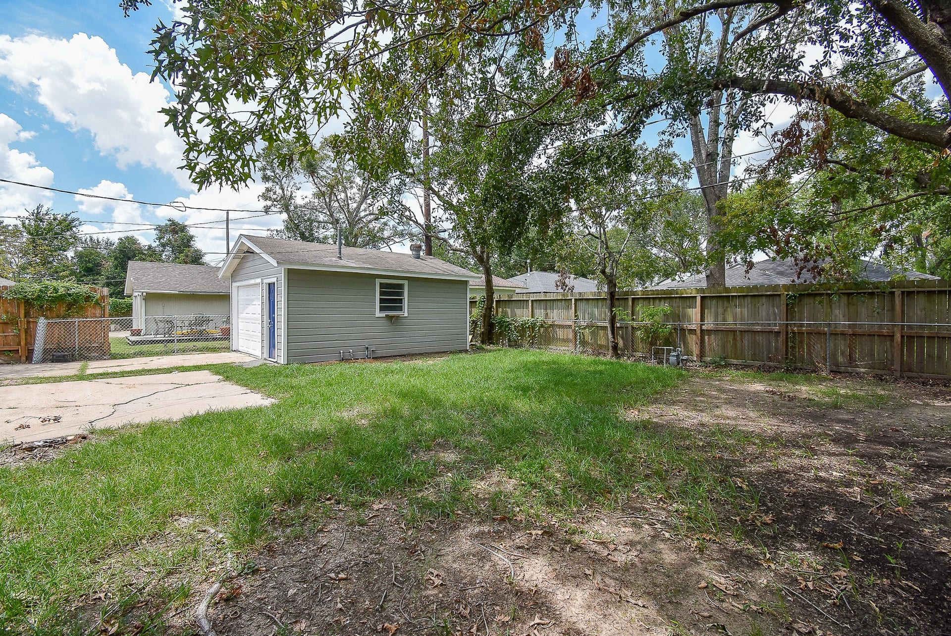 7406 Schiller Street, Houston, TX 77055 Back yard green space.
