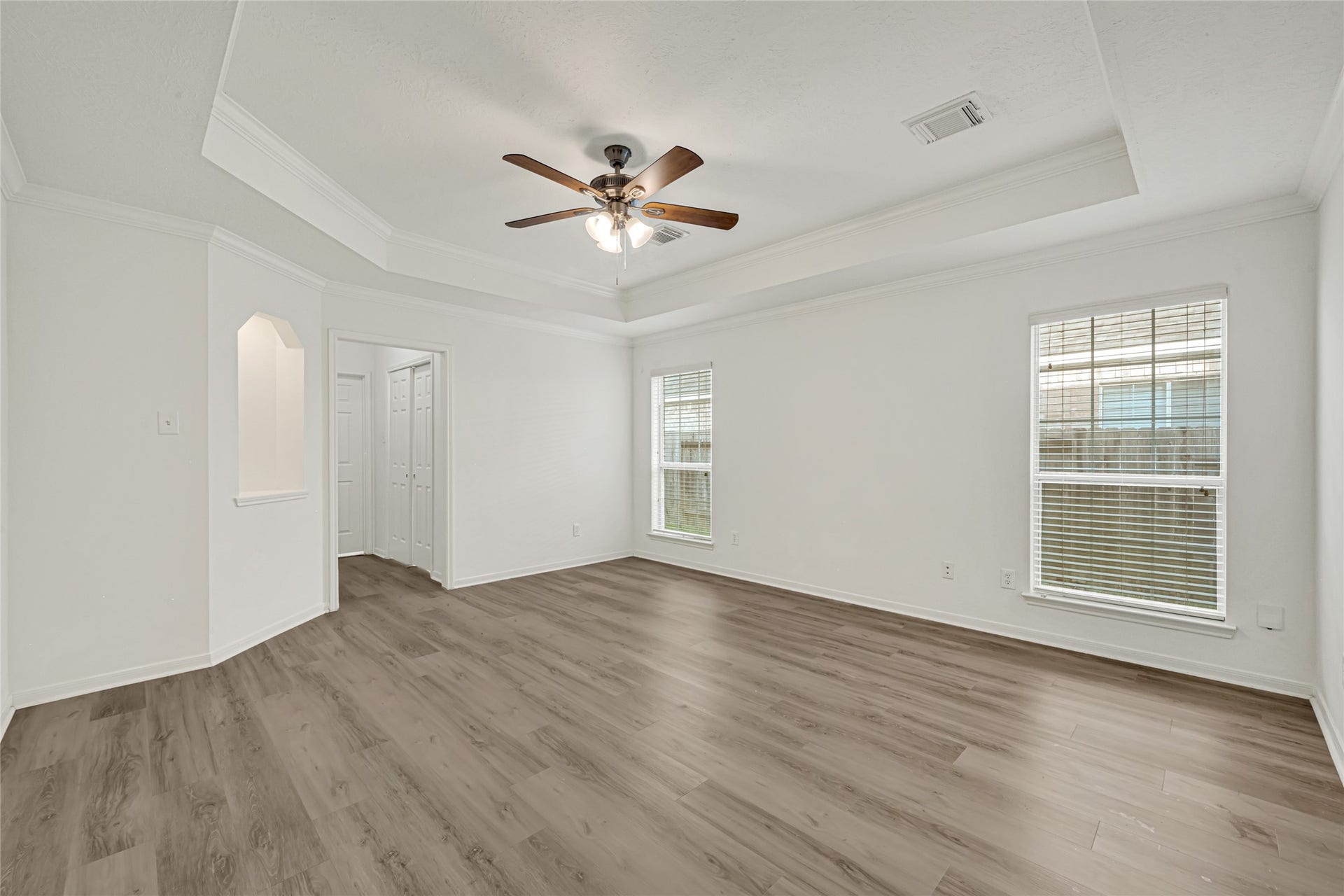 7314 Wooded Lake Lane, Richmond, TX 77407 Spacious Primary Bedroom offering a comfortable retreat with plenty of natural light.