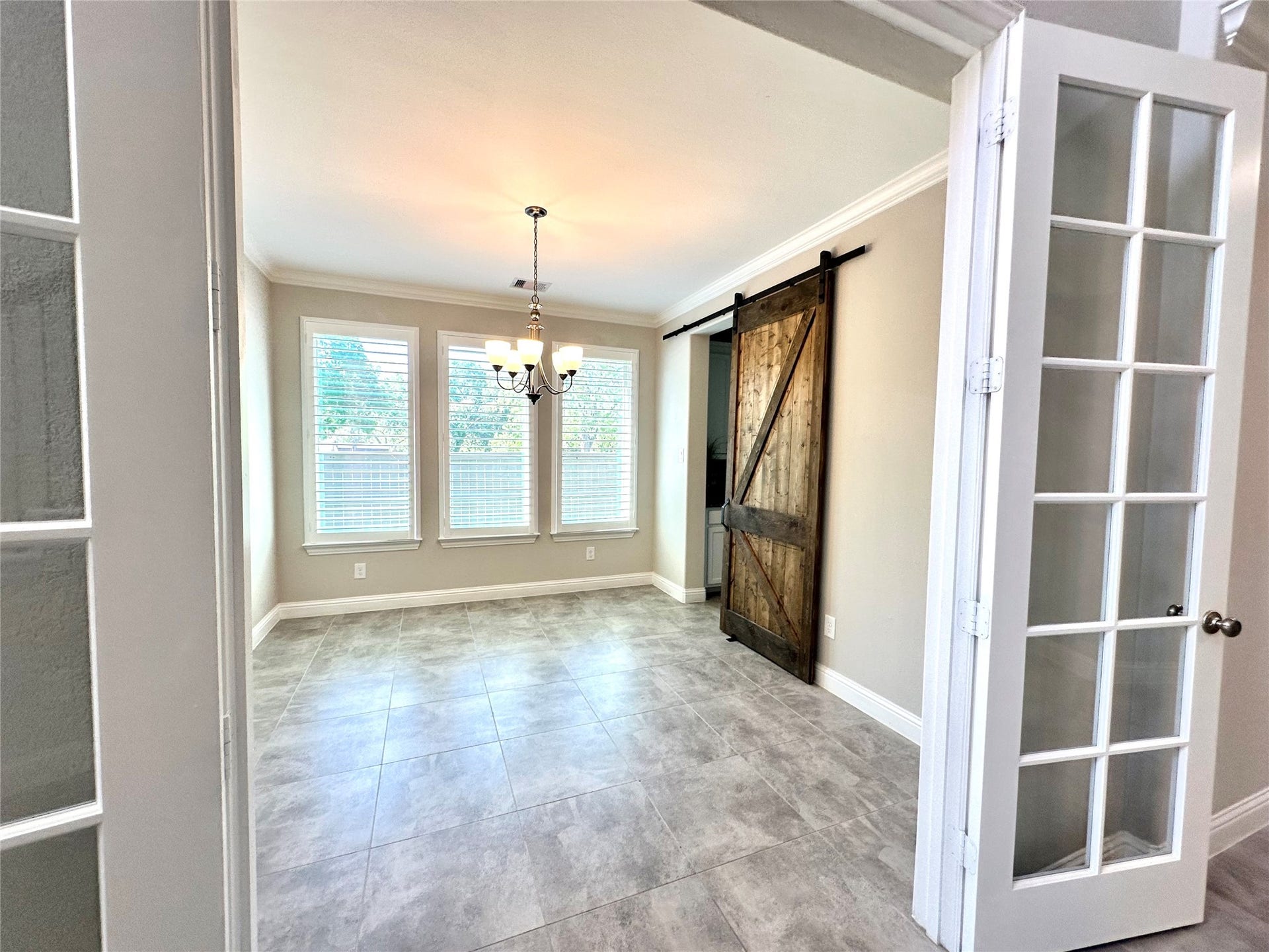 Elegant dining area with double glass doors