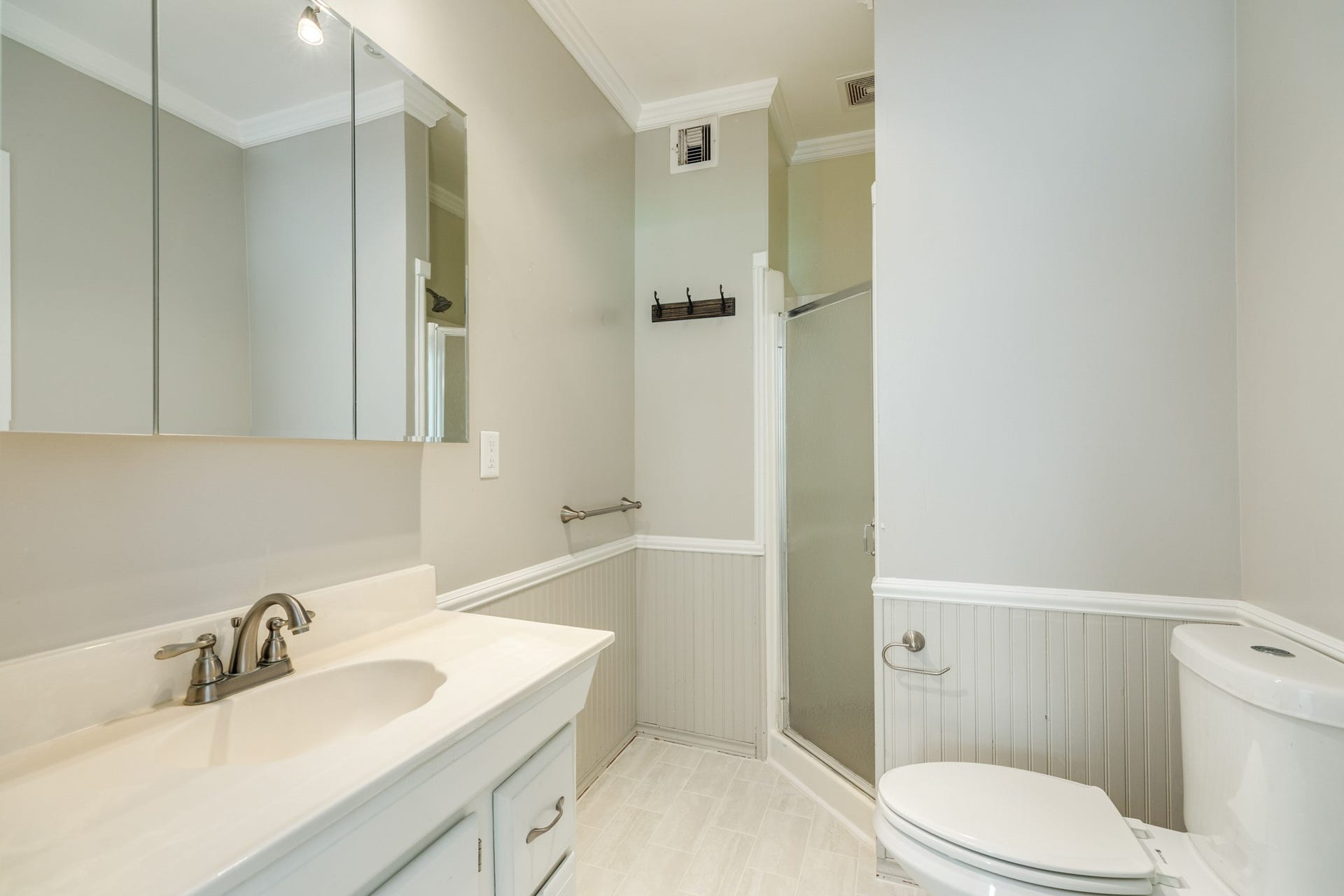 Primary Bathroom with new tile floors.
