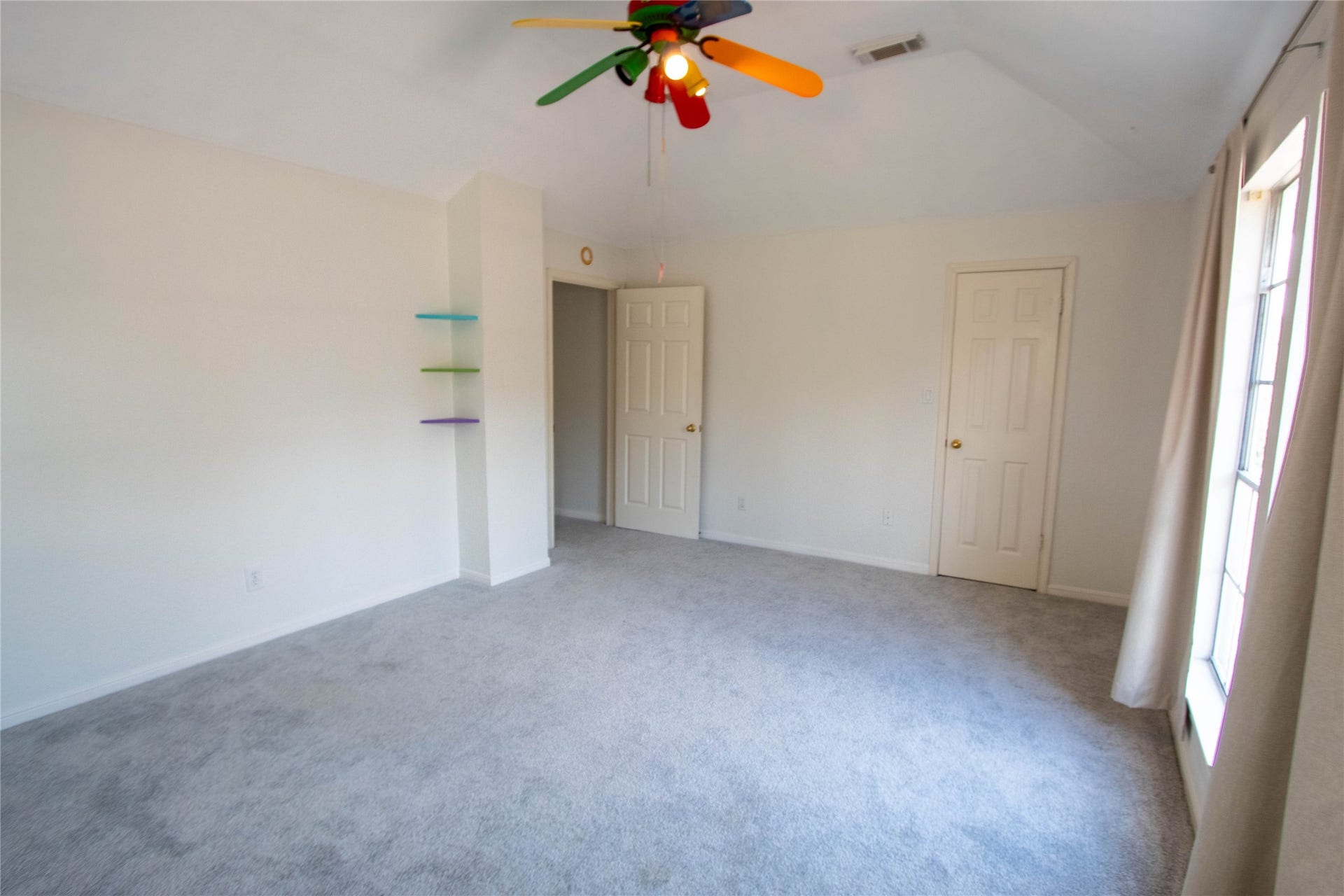 4700 Broadmoor Drive, League City, TX 77573 Secondary bedroom overlooking at the driveway and front yard. This is a large room.