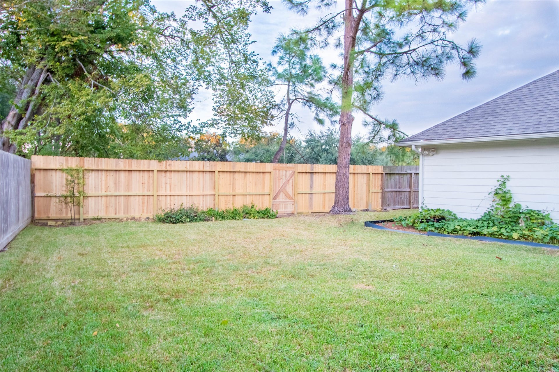 4700 Broadmoor Drive, League City, TX 77573 The backyard green space is large enough for a pool, or a playground. New back fence.