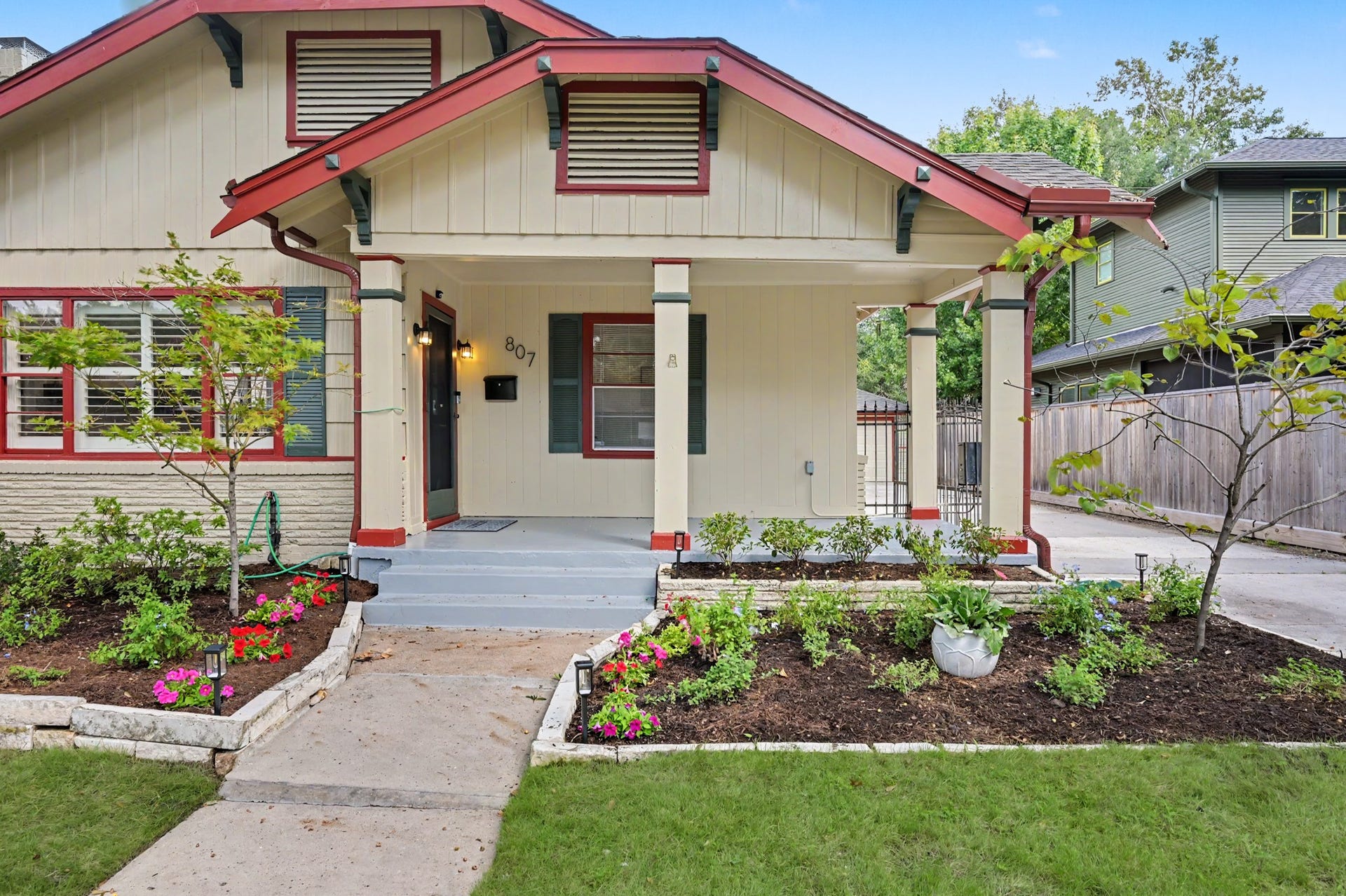 807 Key Street, Houston, TX 77009 Inviting covered front porch surrounded by colorful landscaping and classic architectural details.