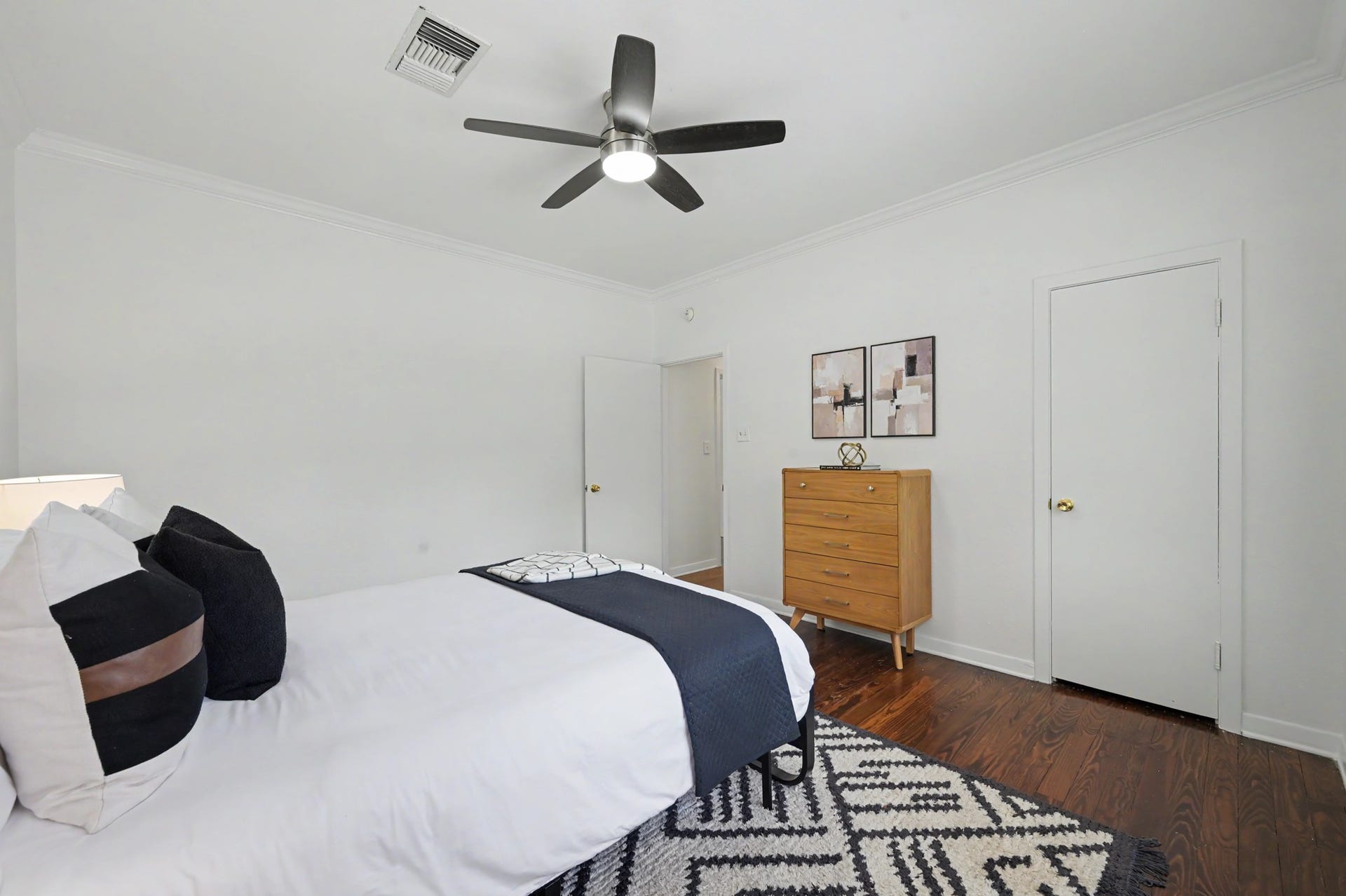 807 Key Street, Houston, TX 77009 Another view of the secondary bedroom showcasing its spacious layout, hardwood floors, and neutral finishes.