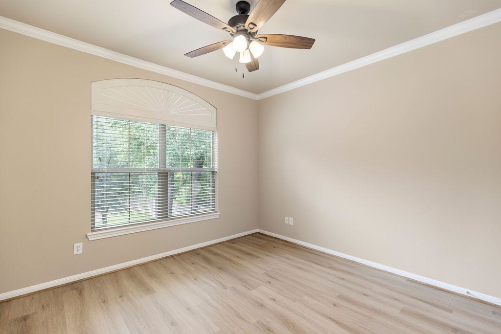 82 Mill Point Place, The Woodlands, TX 77380 The second bedroom looks towards the front.