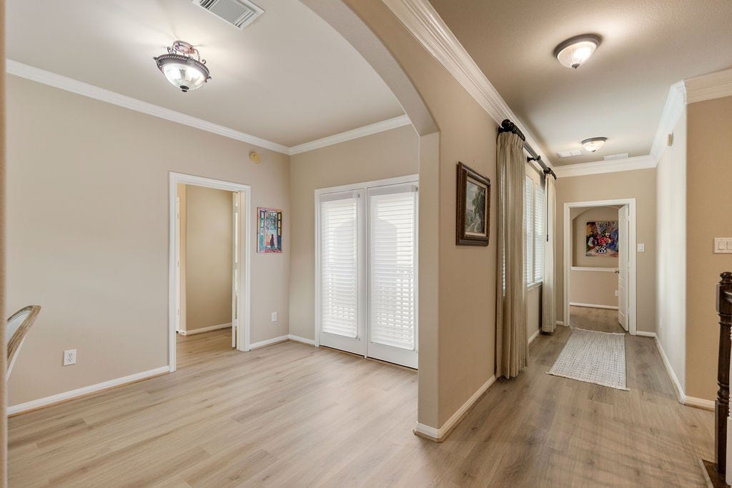 82 Mill Point Place, The Woodlands, TX 77380 Here you can see the flow upstairs that leads to two bedrooms.