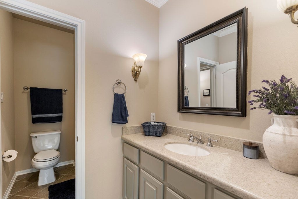 82 Mill Point Place, The Woodlands, TX 77380 This bathroom is shared by both the secondary and third bedroom.