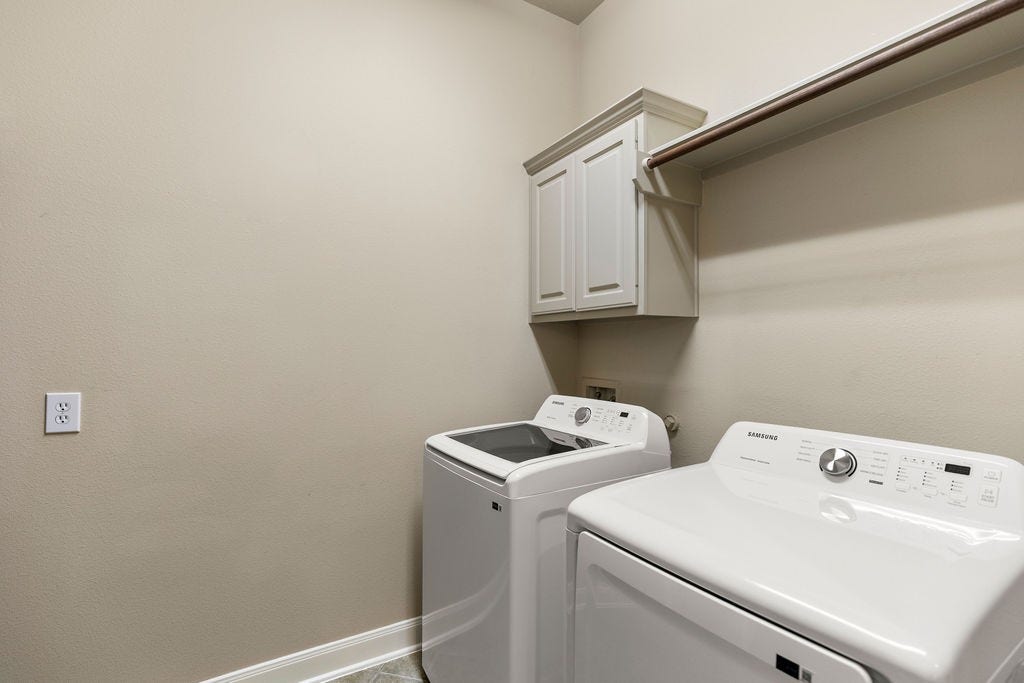 82 Mill Point Place, The Woodlands, TX 77380 Additional storage is to the left here in the utility room.