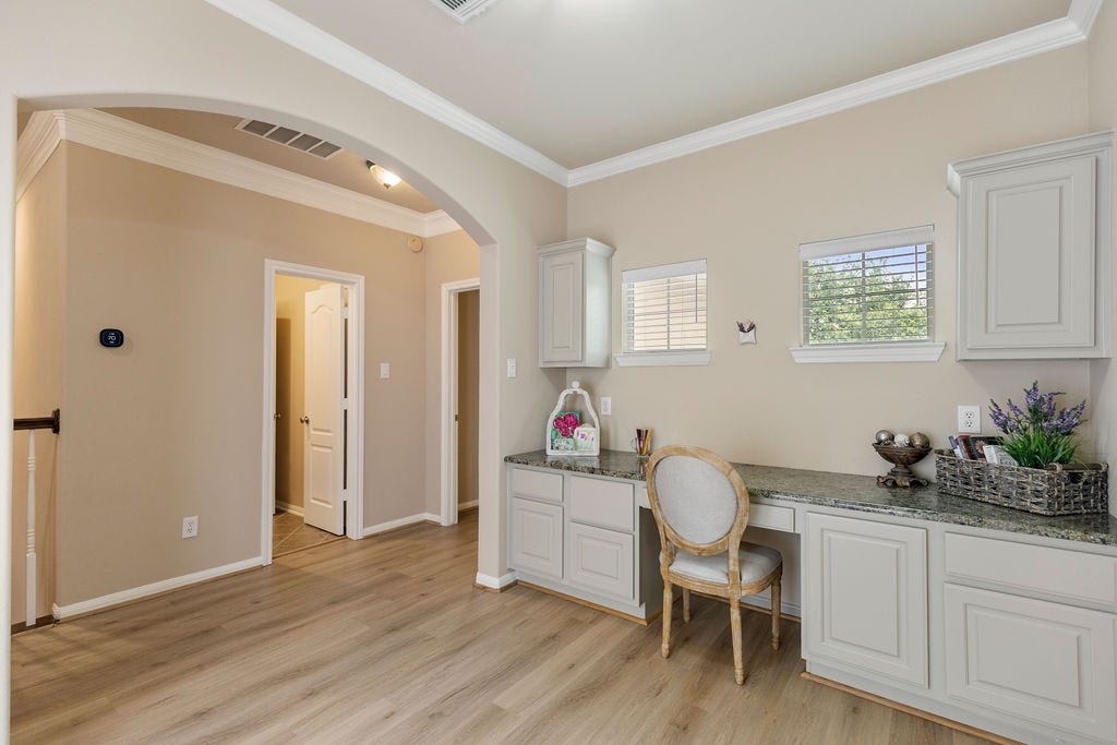82 Mill Point Place, The Woodlands, TX 77380 A nice upstairs study area that can be used as a craft room, or second work from home space.