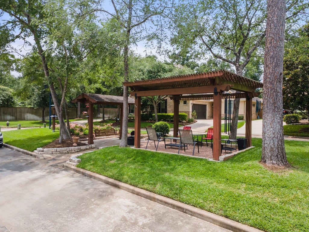 82 Mill Point Place, The Woodlands, TX 77380 Across the street from a lovely community sitting area.
