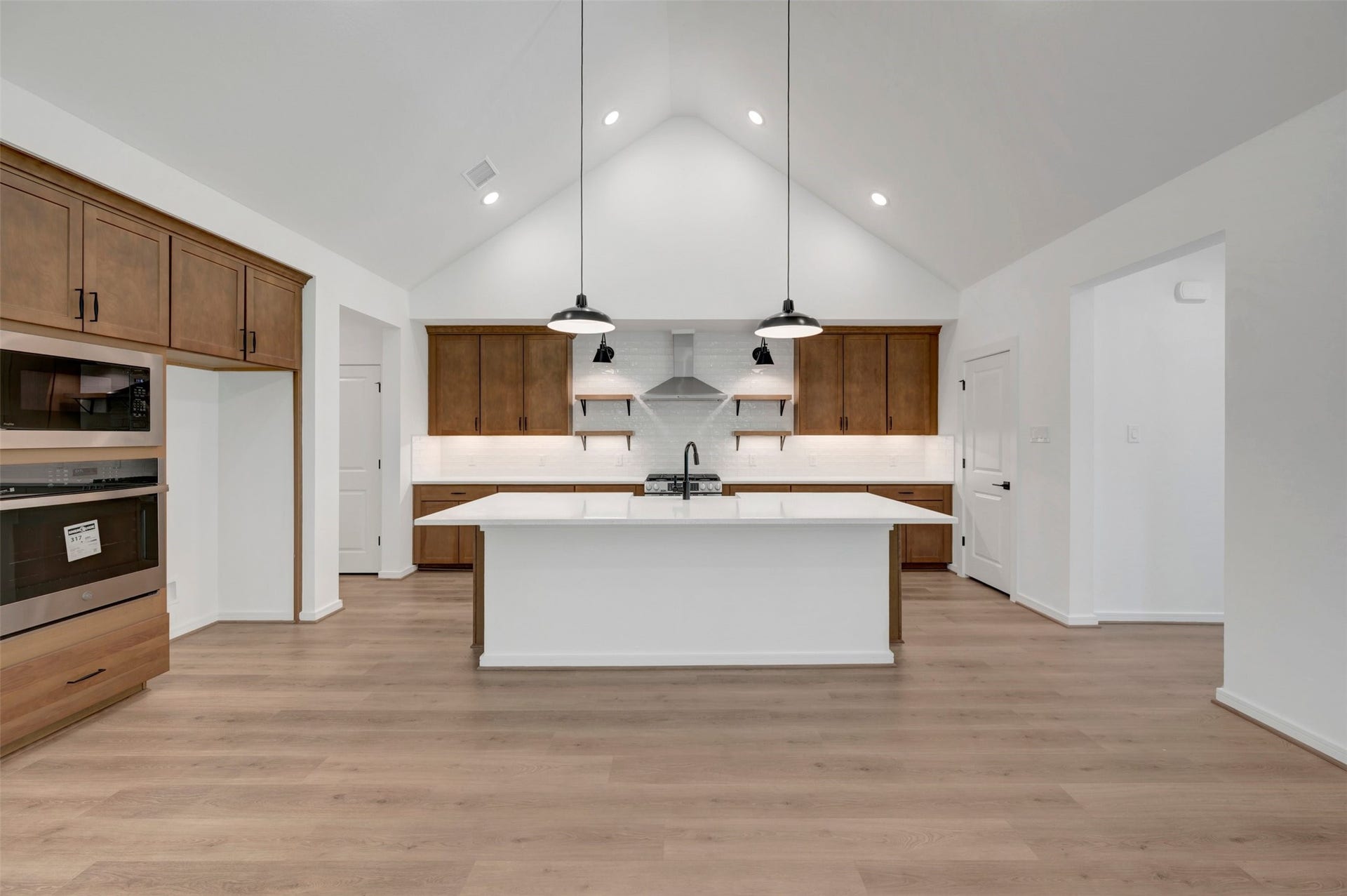 2124 River Maple Drive, Magnolia, TX 77363 Gourmet island kitchen (*Photo not of actual home and used for illustration purposes only. Colors/finishes may differ from the ones currently selected in the home.)