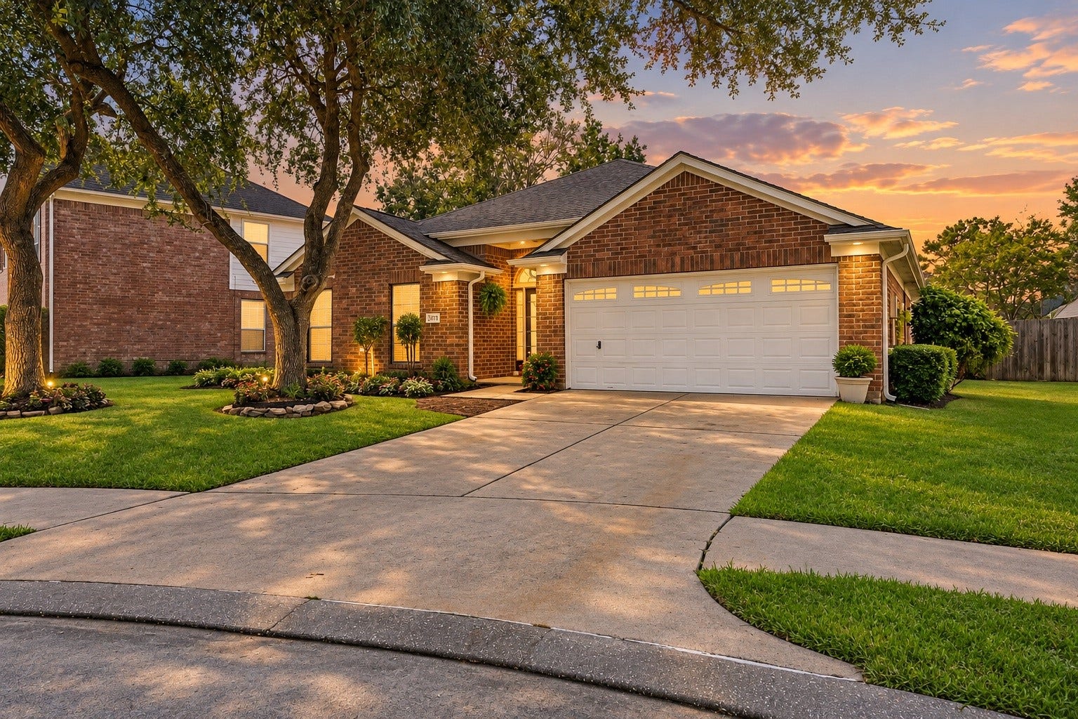 2331 Princess Deanna Lane, Katy, TX 77493 Featuring rich brickwork and multiple rooflines, this home sits on a deep lot framed by grand shade trees and custom stone flower beds.