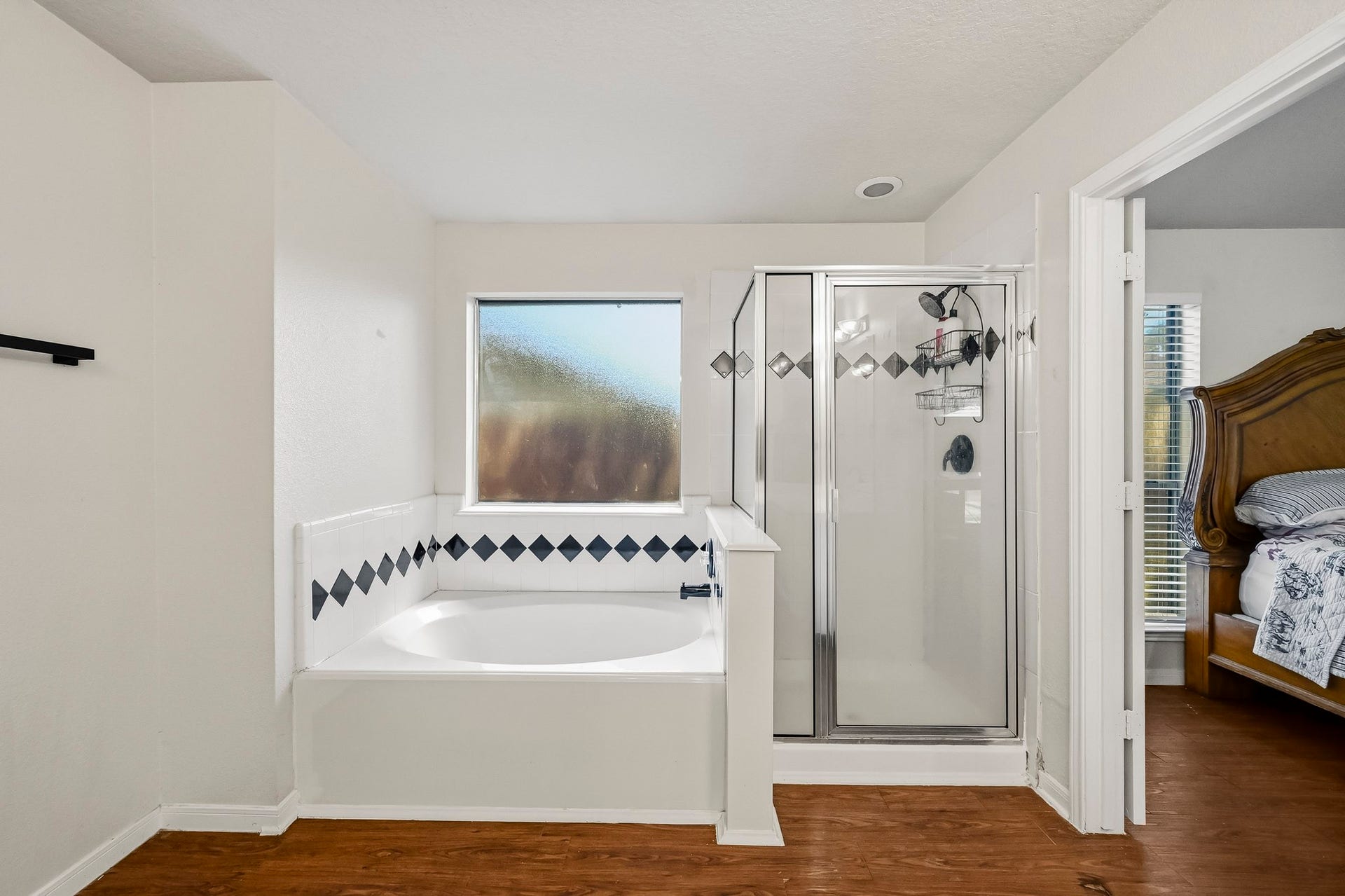 2331 Princess Deanna Lane, Katy, TX 77493 The primary bath includes a spacious soaking tub for relaxation and a dedicated shower enclosure.