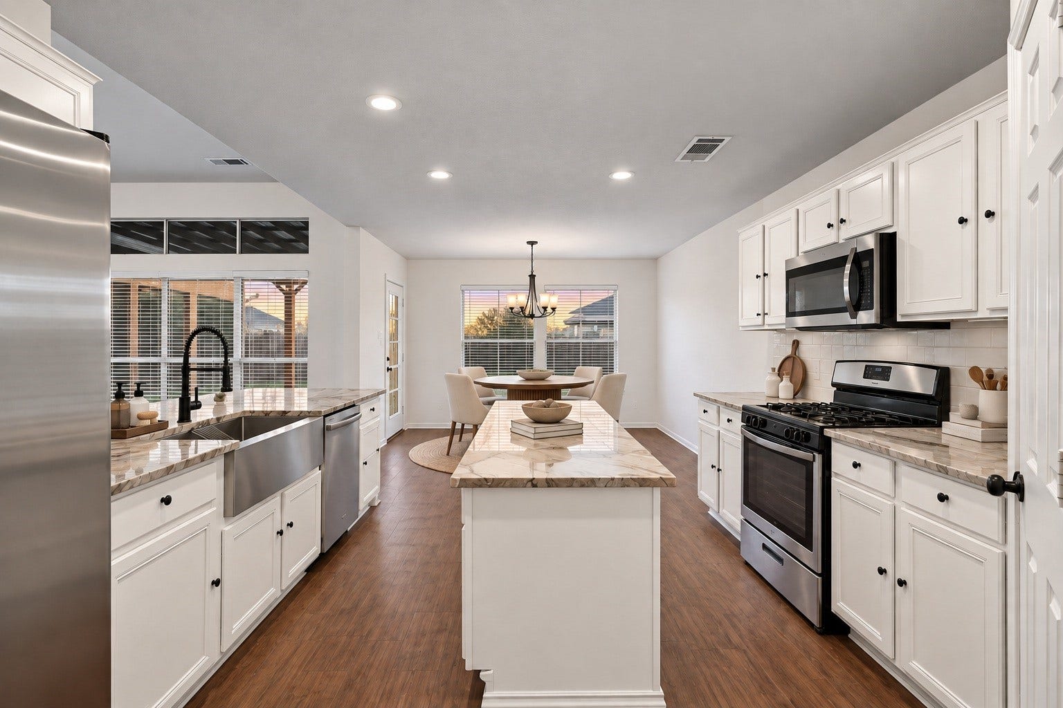 2331 Princess Deanna Lane, Katy, TX 77493 Virtually Staged: Stainless steel appliancesincluding a gas range, built-in microwave, and dishwasherare complemented by generous cabinet storage, recessed lighting, and a open flow into the adjacent dining area.