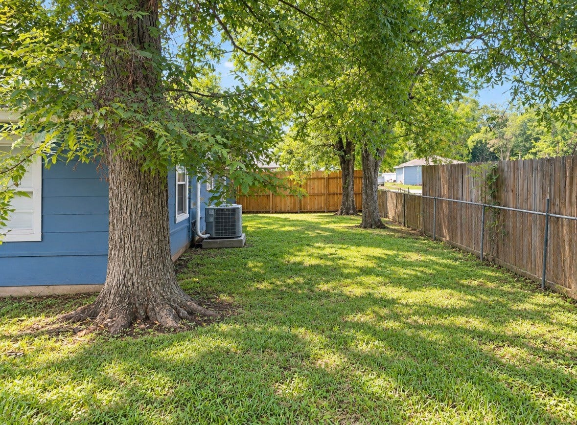 11929 15th Street, Santa Fe, TX 77510 Step out back to a shady yard with mature trees and room to enjoy the outdoors