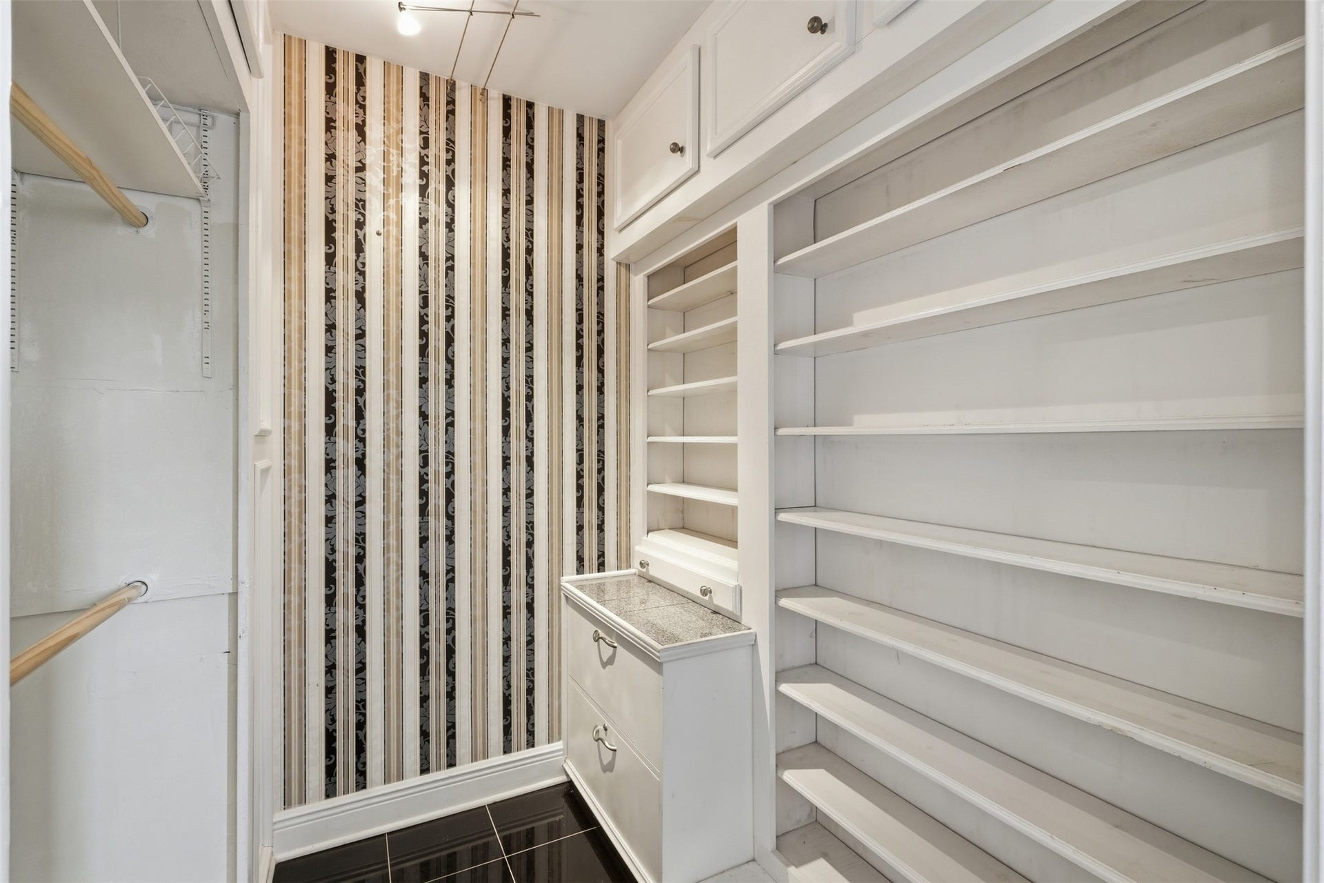 Walk-in closet provides excellent storage for clothing, seasonal items, and more.