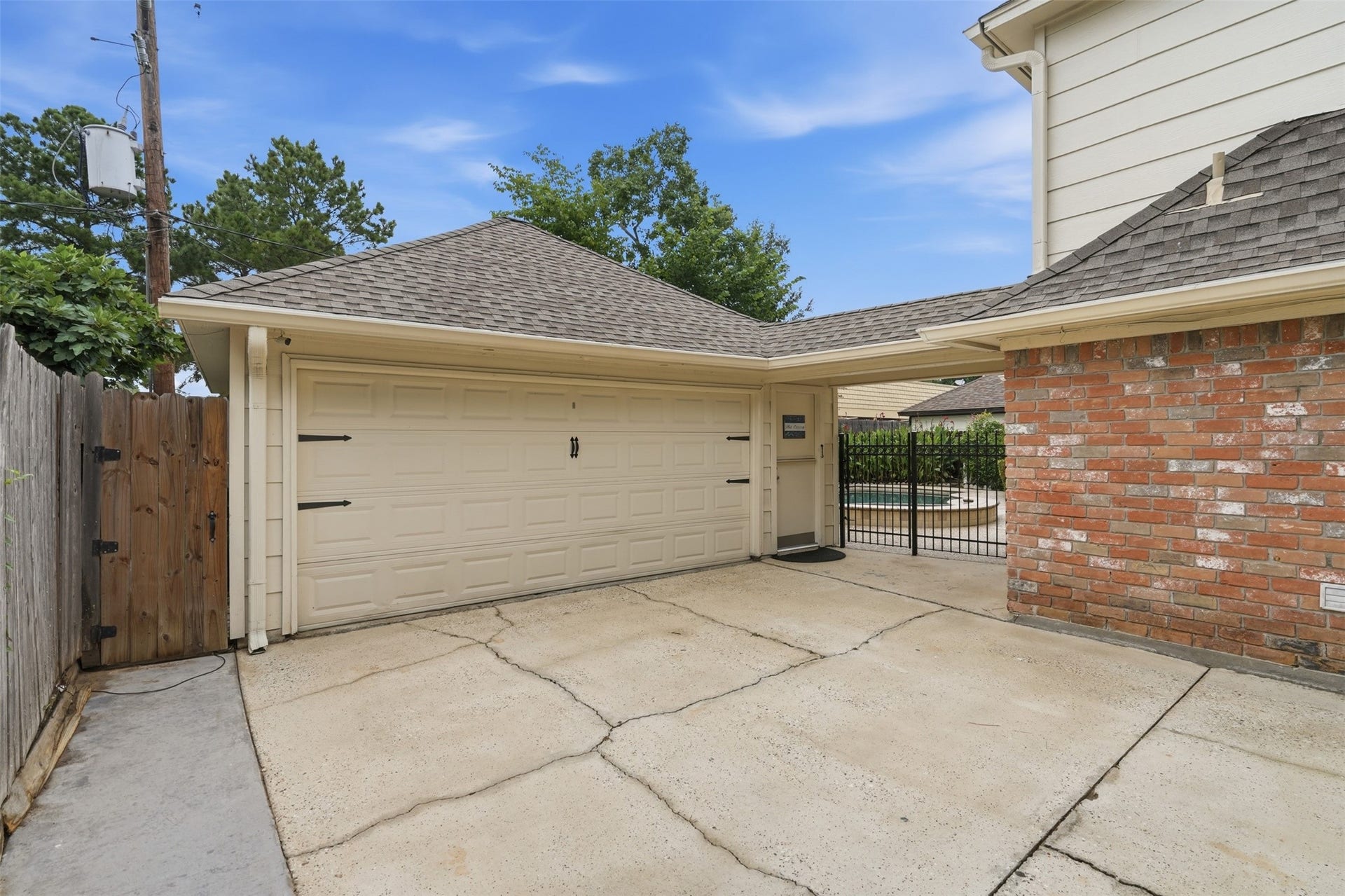 The backyard is fulled fenced even along the path from the home to the detached garage.
