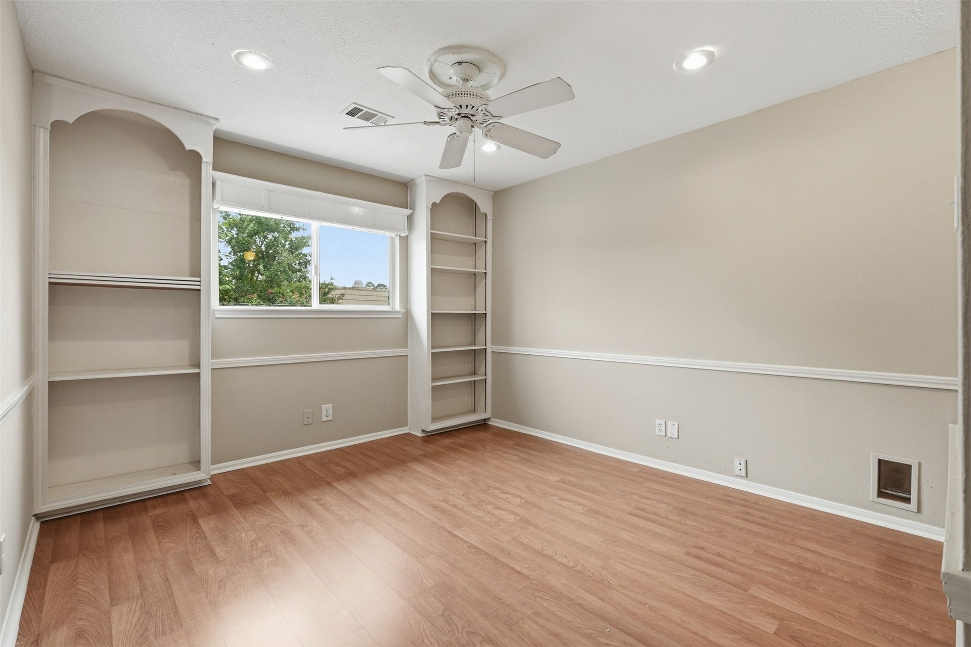Another spacious secondary bedroom offers comfort, privacy, and abundant natural light.