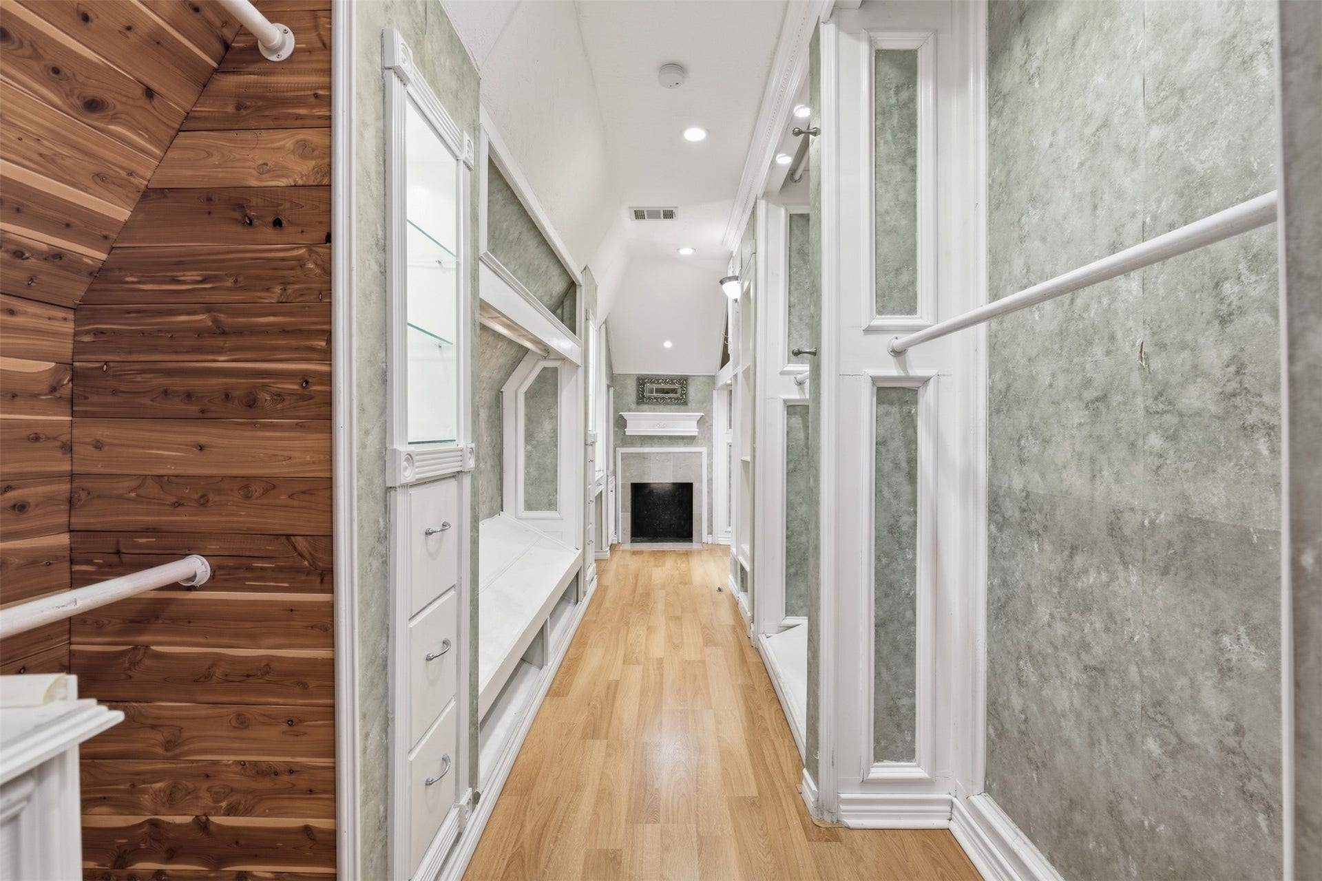 A private staircase in the primary bathroom leads to the incrediable primary closet, offering exceptional storage and organization.